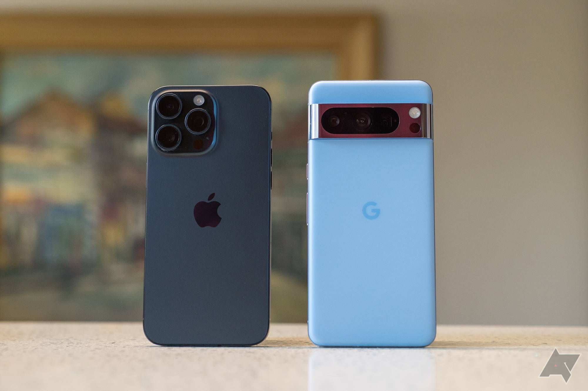 The iPhone 15 Pro Max next to the Pixel 8 Pro