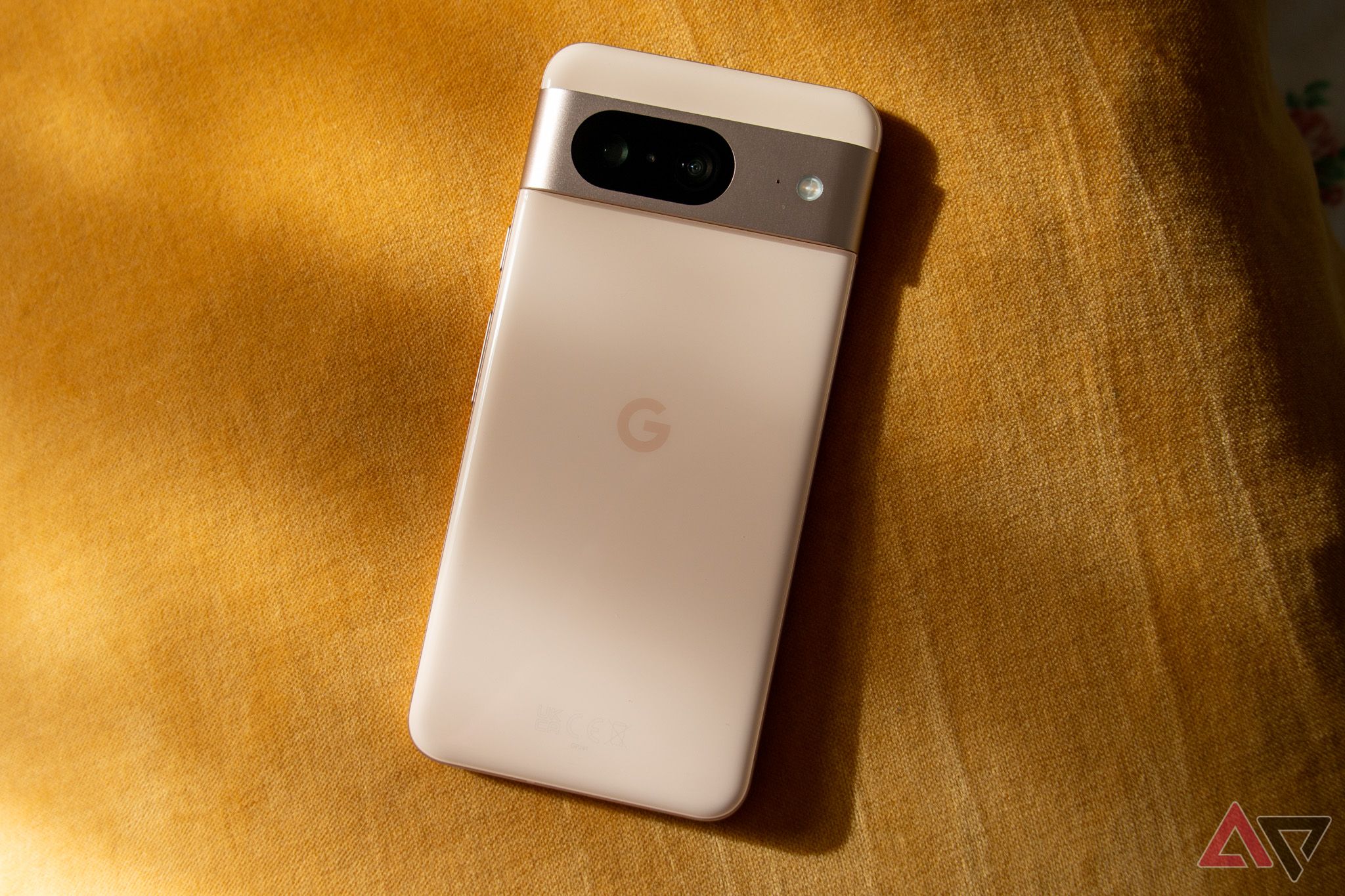 Google Pixel 8 in rose face down on a table