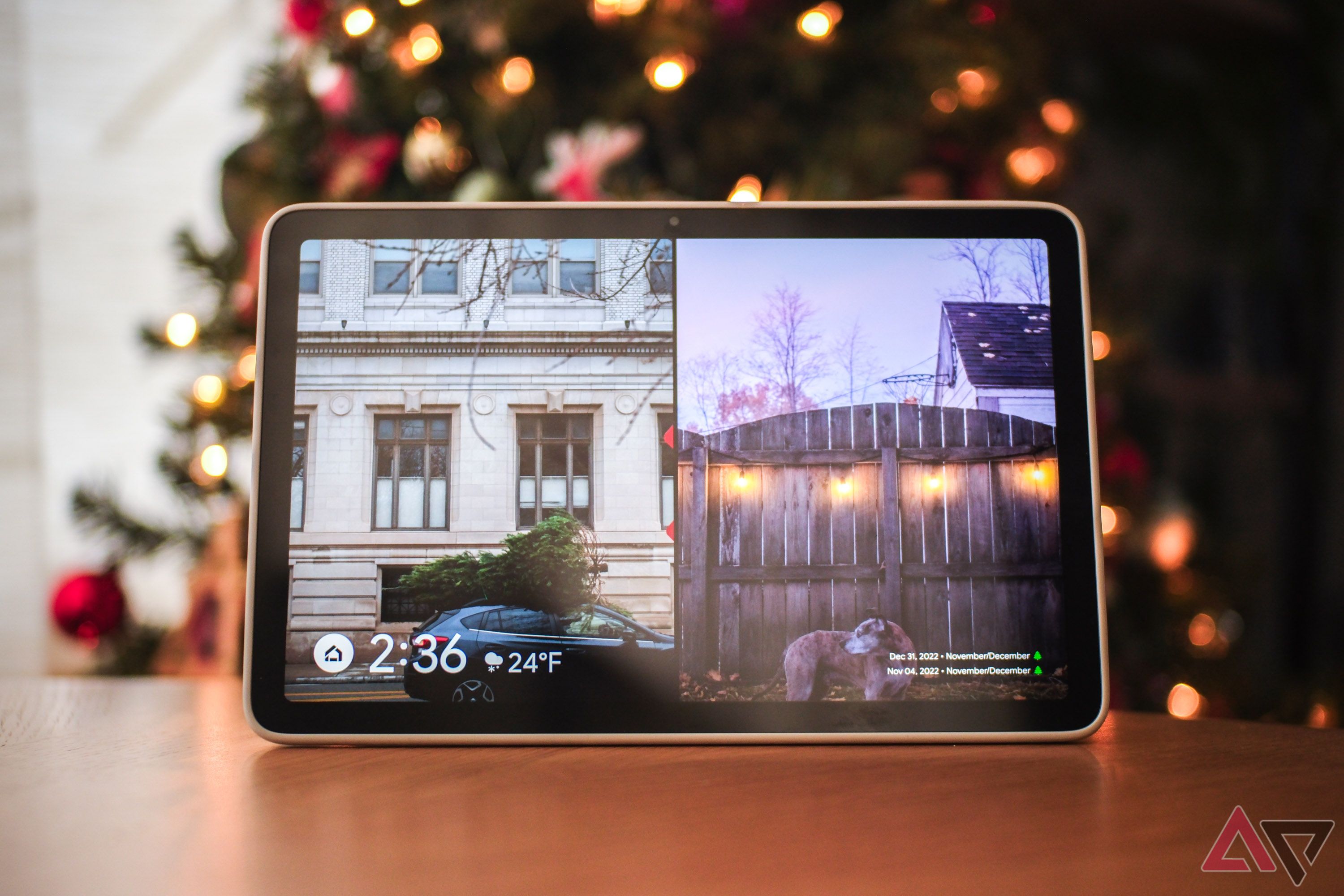 A Google Pixel Tablet in Hub Mode in front of an illuminated Christmas tree