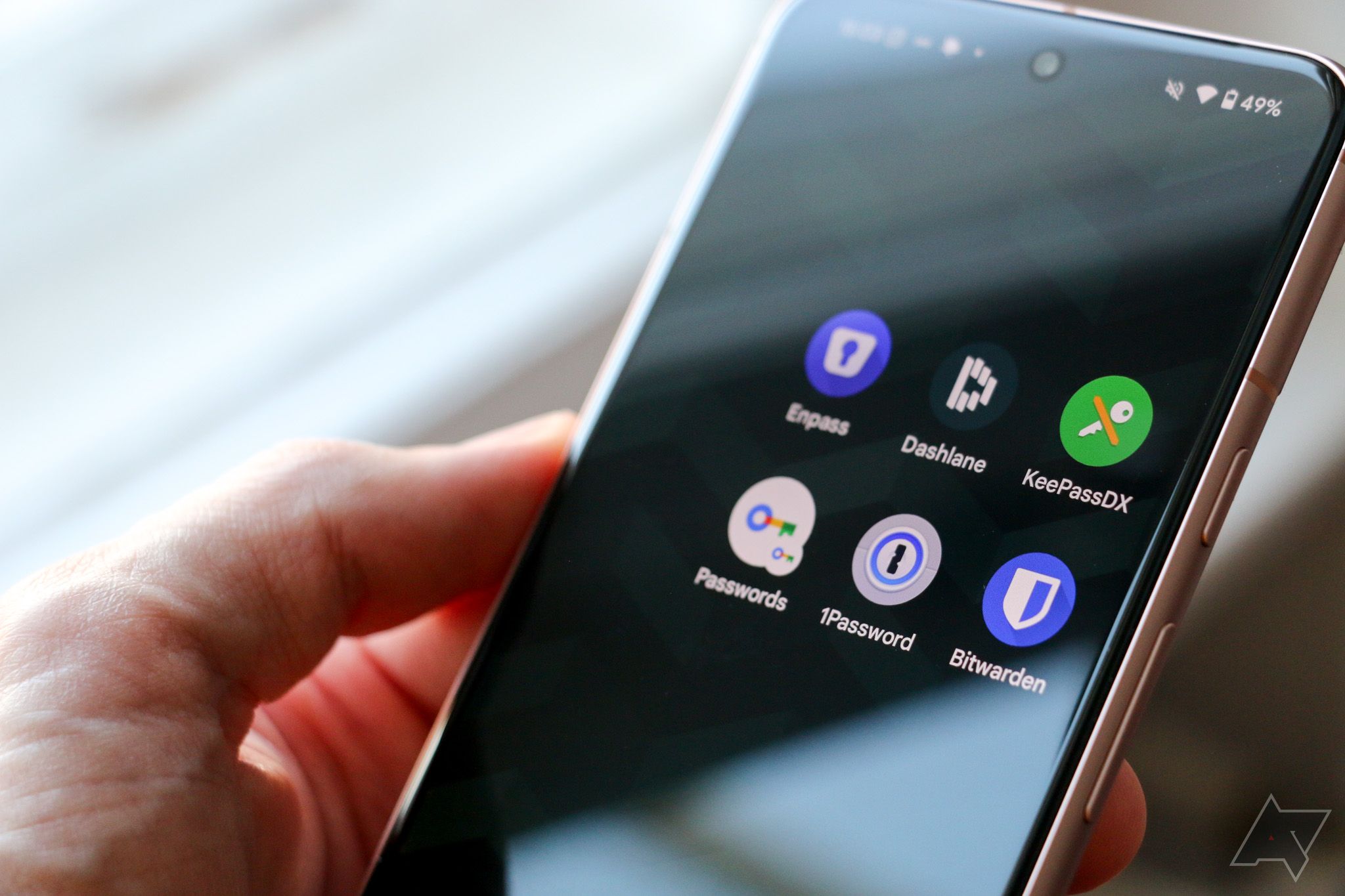 Six different password managers arranged artfully on an Android phone's home screen