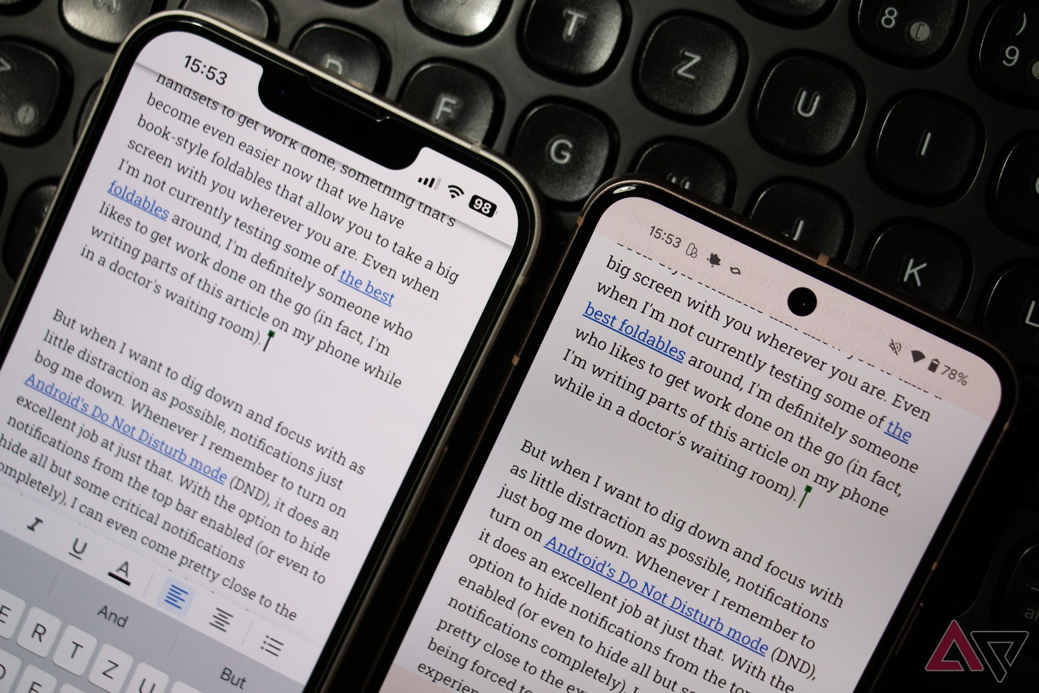 An Apple iPhone 13 and a Google Pixel 8 next to each other on a keyboard, showing an identical Google Docs document on the screen