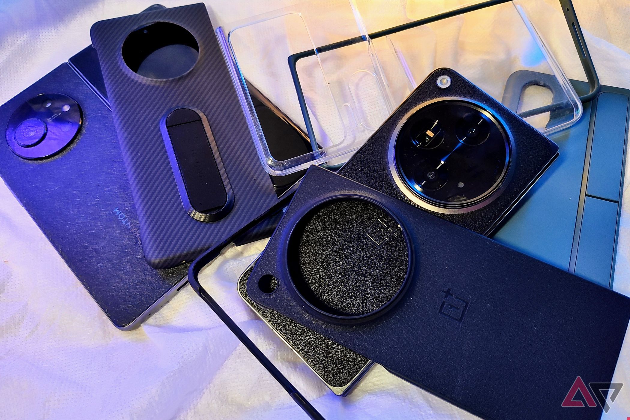 OnePlus Ope and Tecno Phantom V with cases on a table