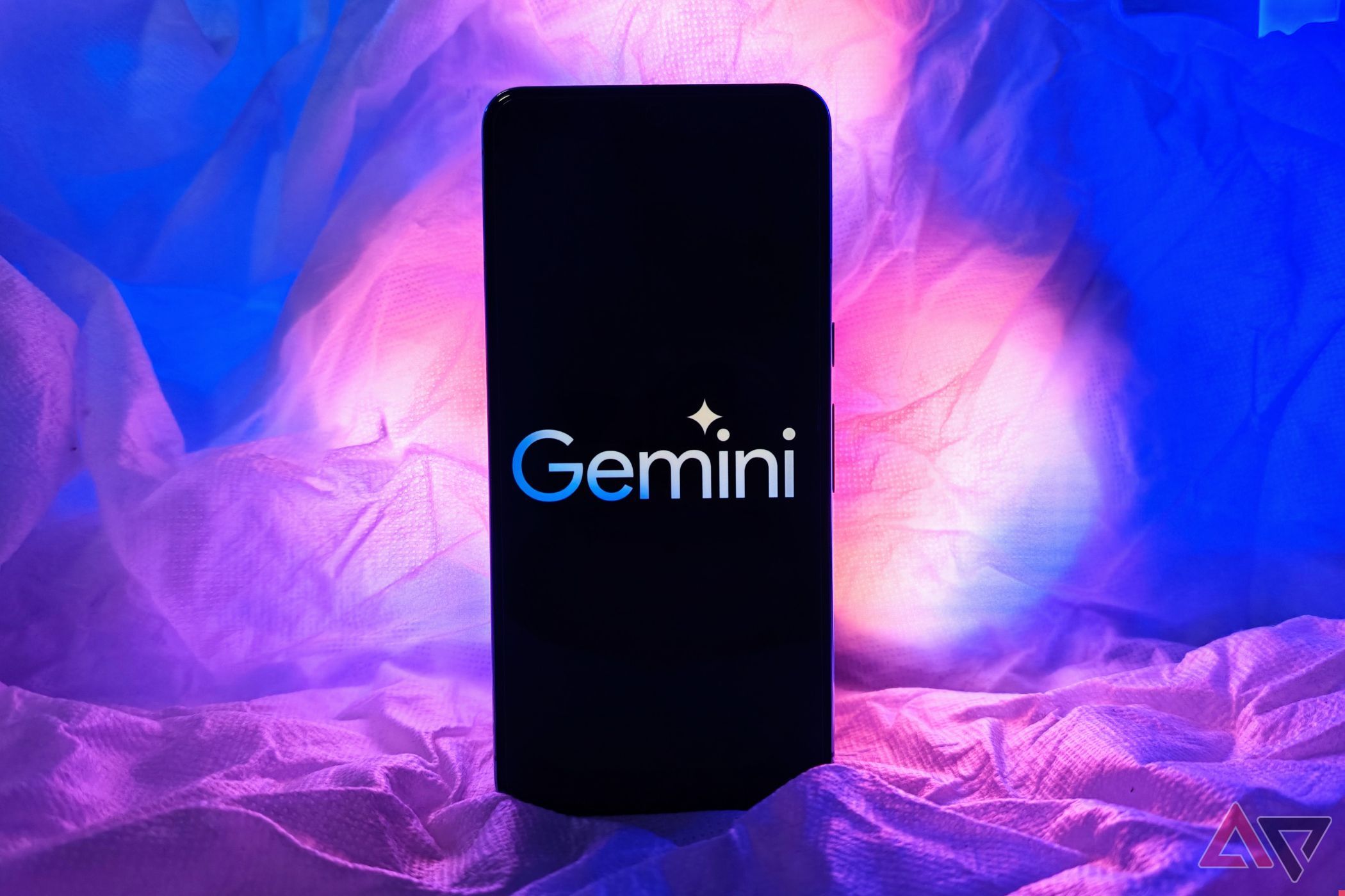 Google Pixel 8 Pro with Gemini logo on the screen with RGB lights behind