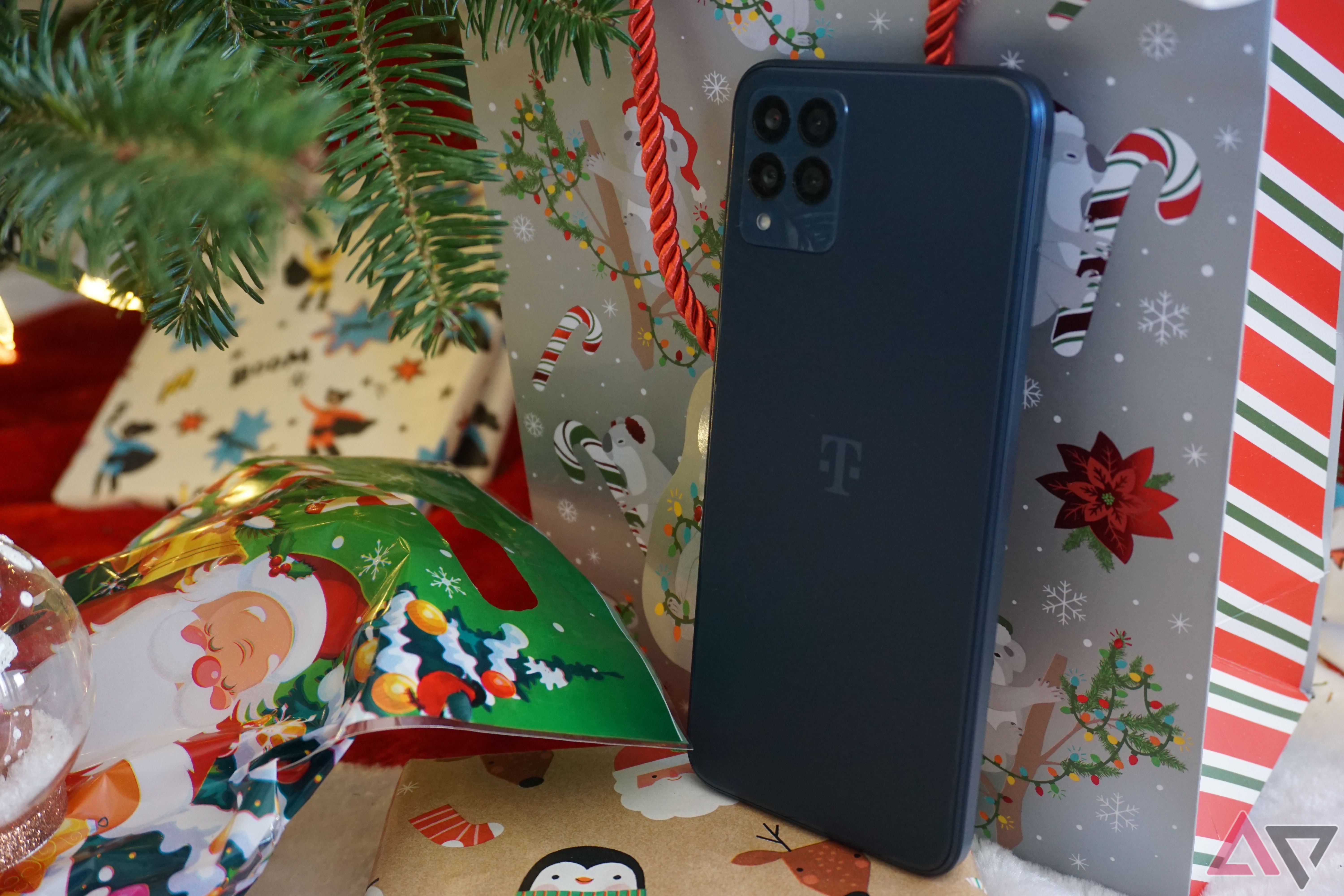 The back of the T-Mobile REVVL 6x Pro in front of presents