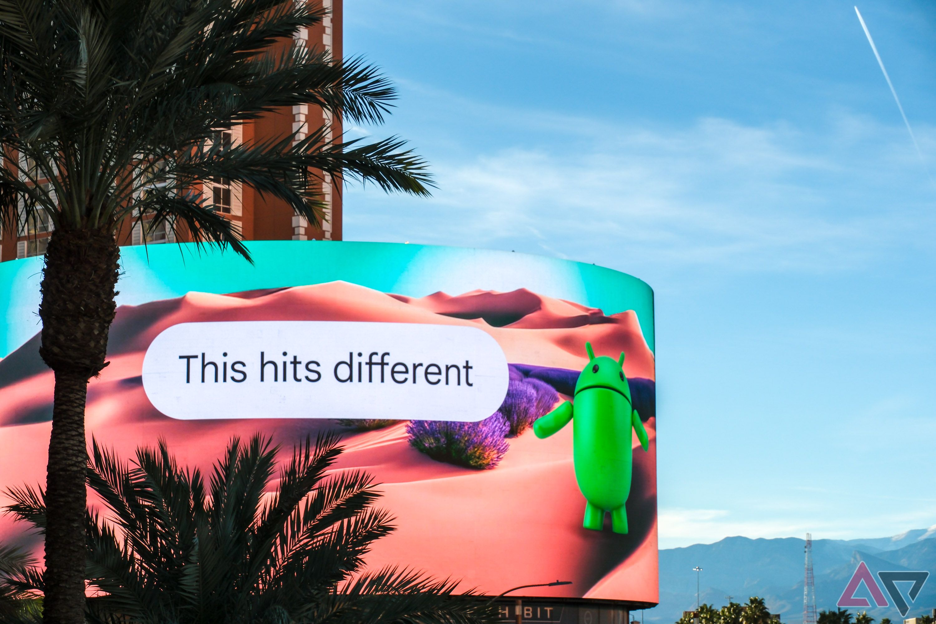 A billboard with Android bot mascot and text reading 'This hits different'