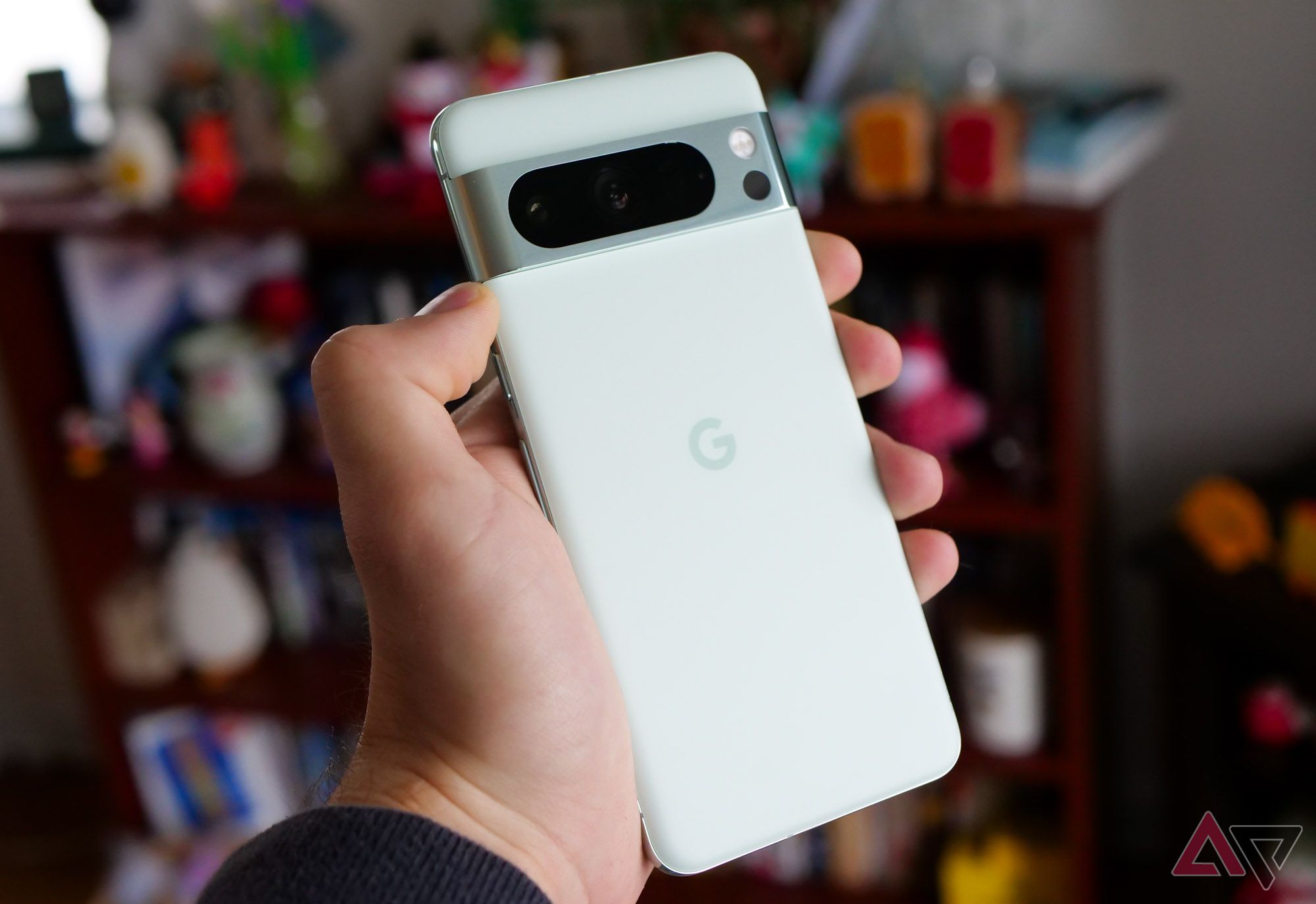 Google's Pixel 8 Pro in mint in a hand