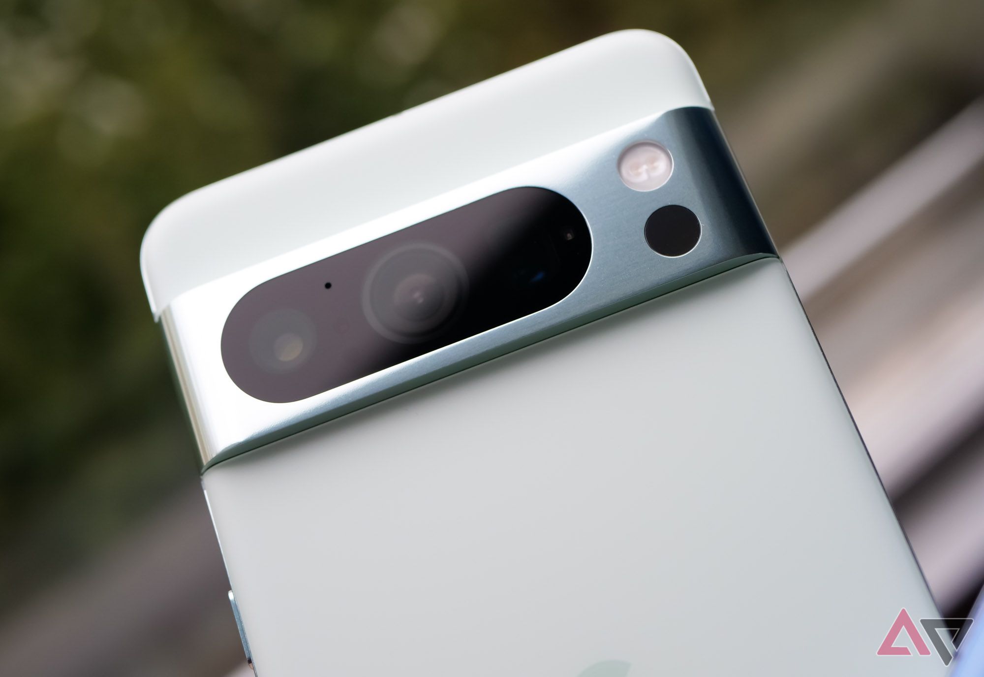 Google's Pixel 8 Pro in mint with a close up on the camera bar.