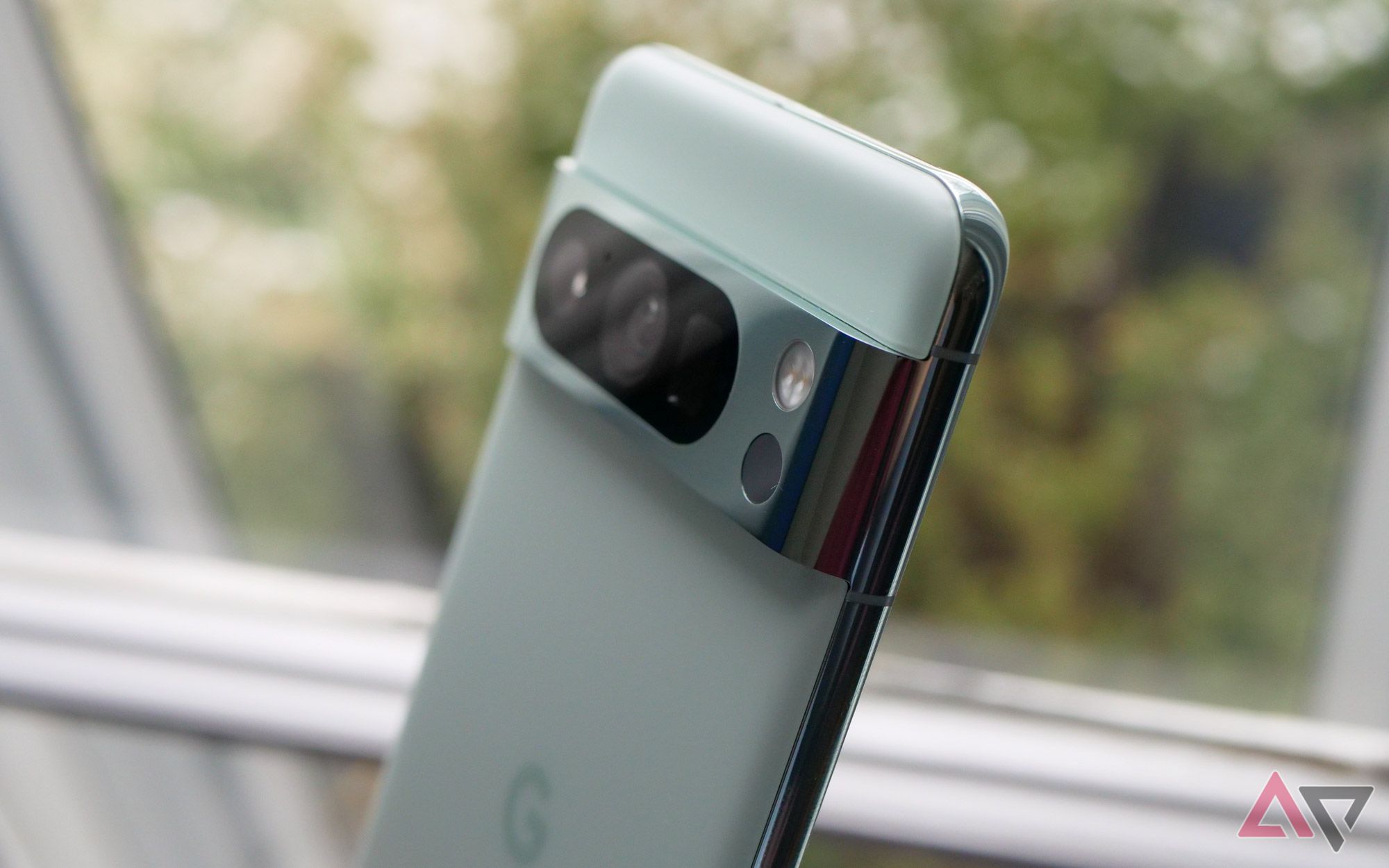 Google's Pixel 8 Pro in mint with a focus on the camera bar