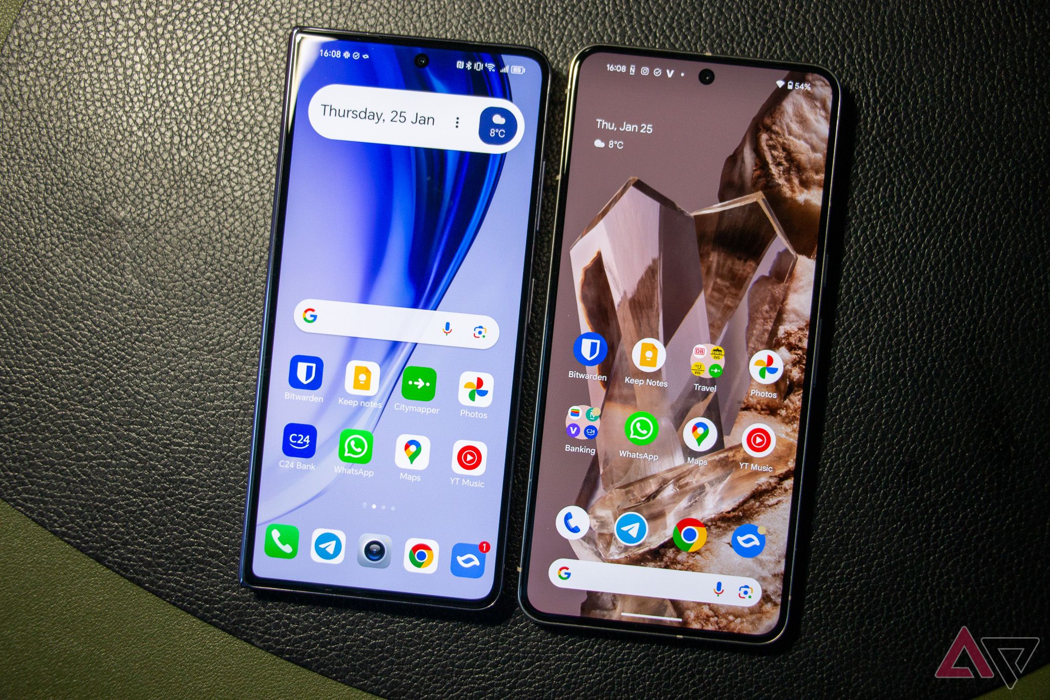 The Honor Magic V2 and the Google Pixel 8 Pro next to each other with the screens turned on