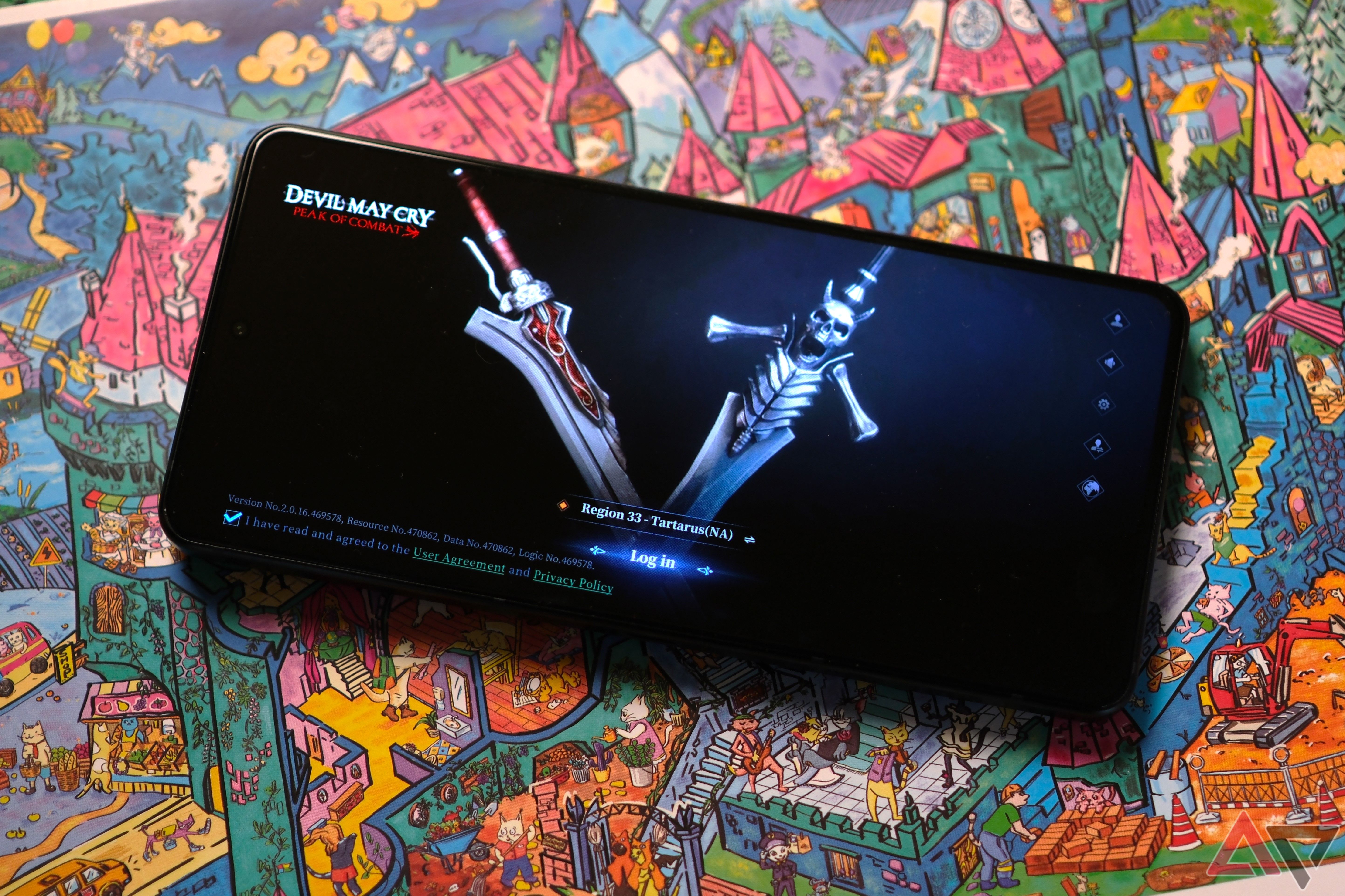 ROG Phone 8 Pro playing devil may cry while laying on colorful drawing