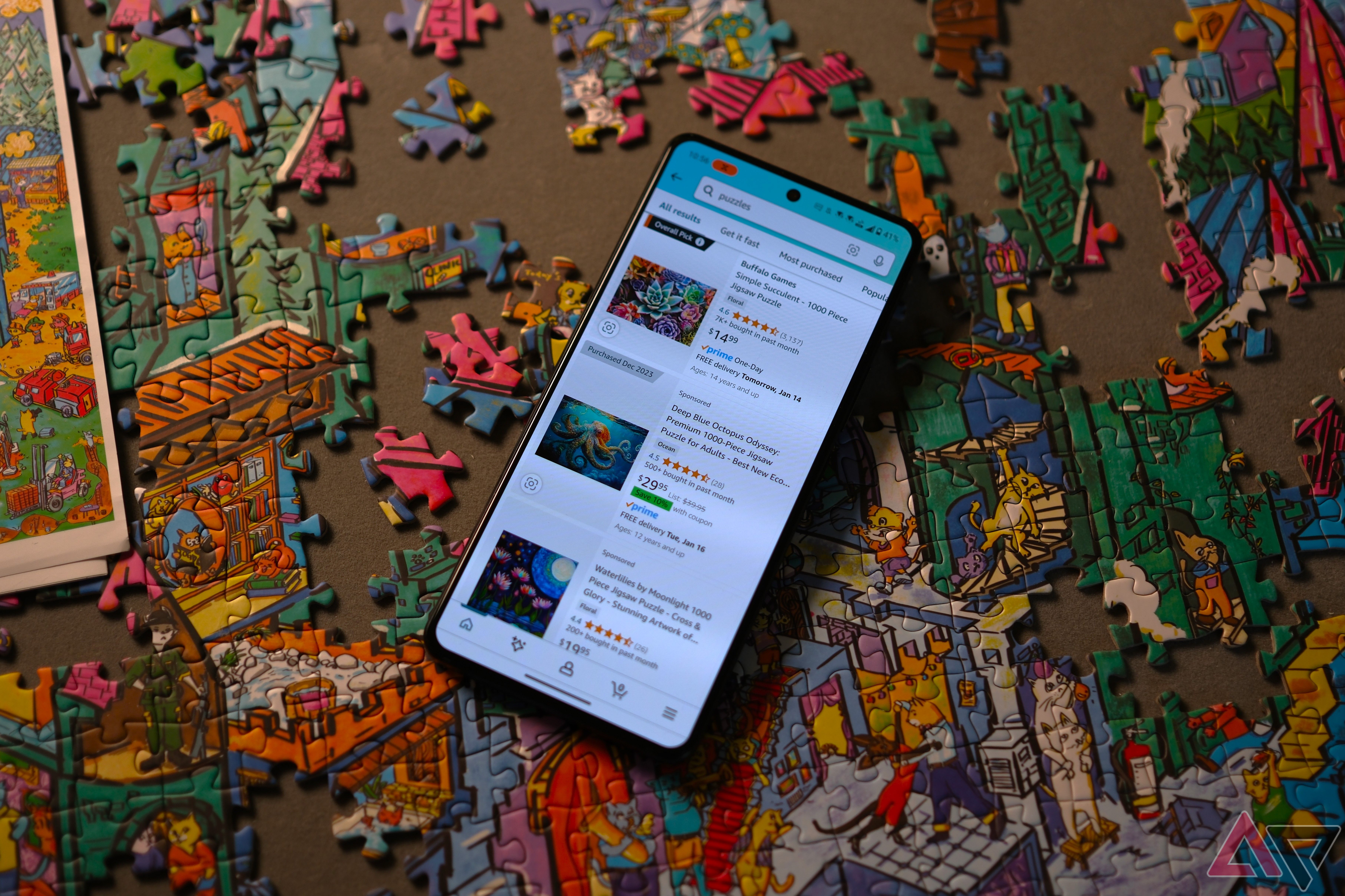 ROG Phone 8 Pro showing amazon app shopping for puzzles while laying on puzzle