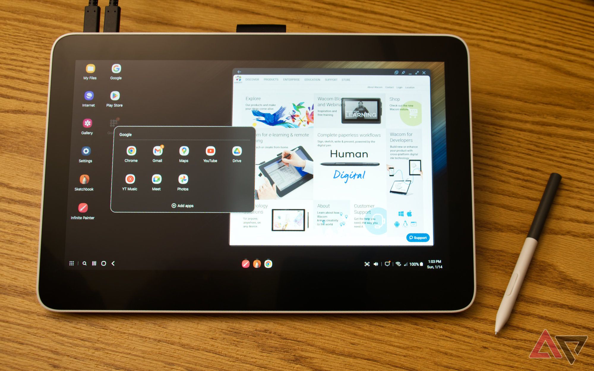 Wacom One 13 Touch running DeX and showing an open application folder and a browser window