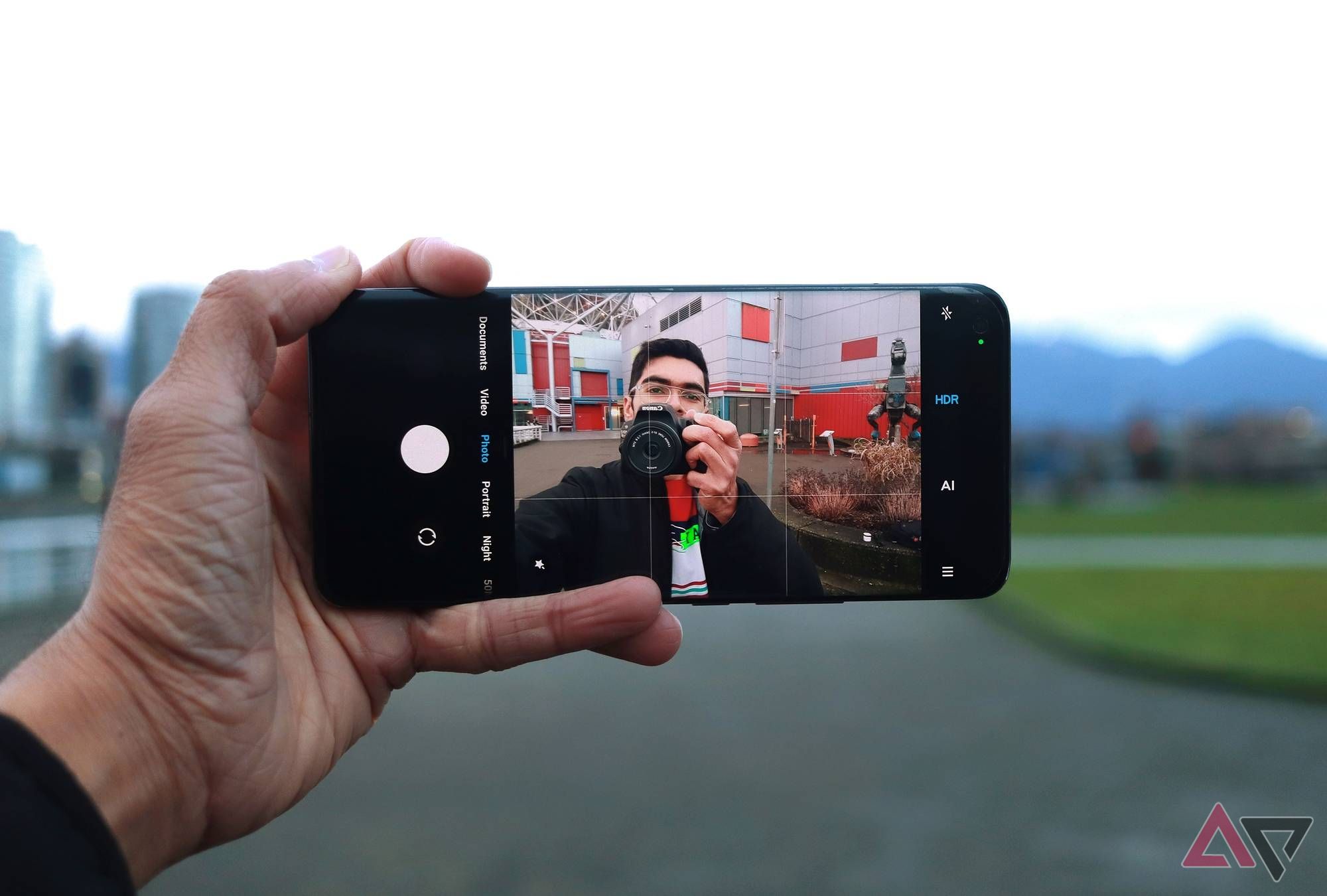 The Xiaomi Mi 11 Ultra being held up with its viewfinder open on selfie mode.