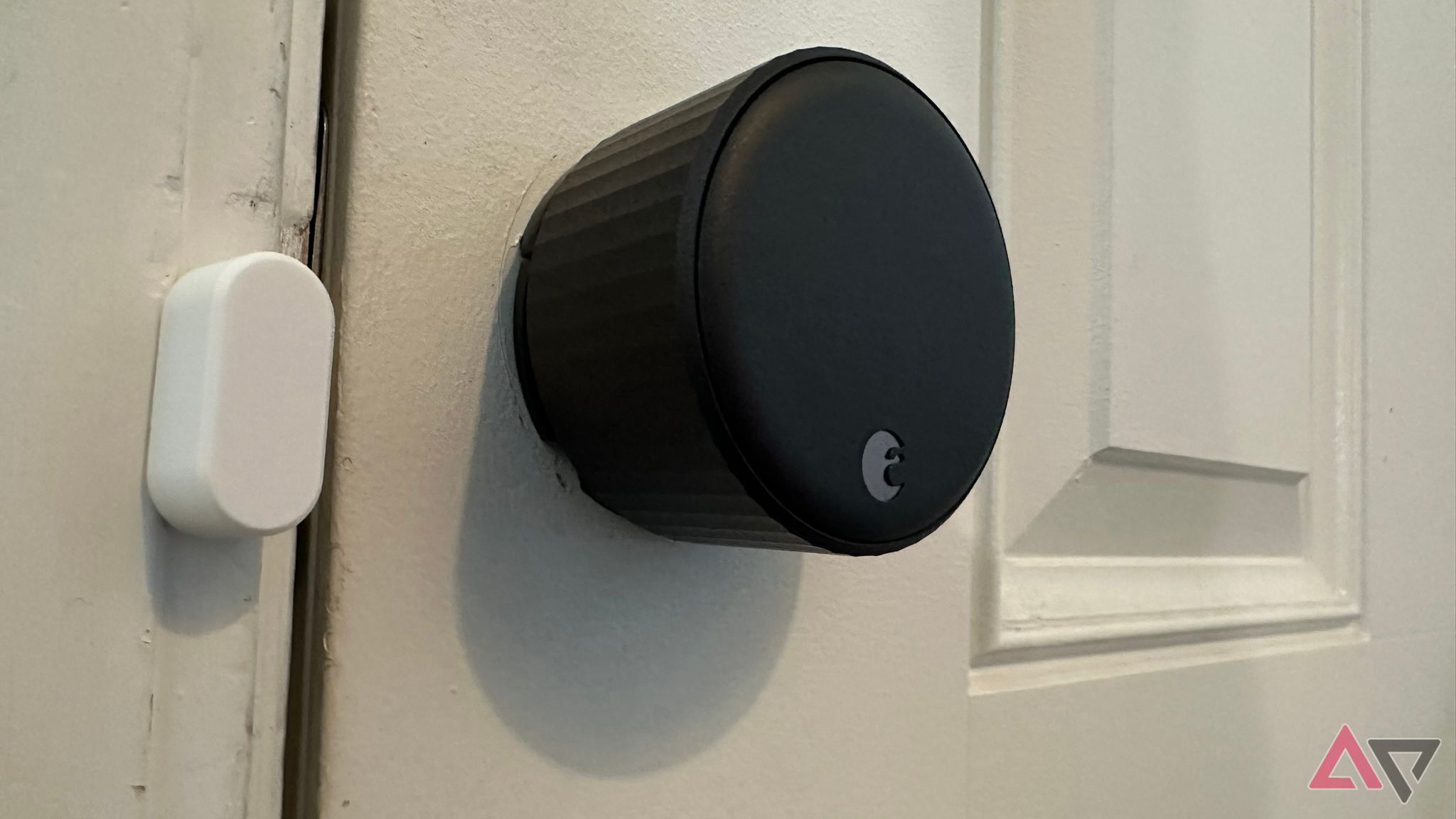 August Wi-Fi Smart Lock with its sensor