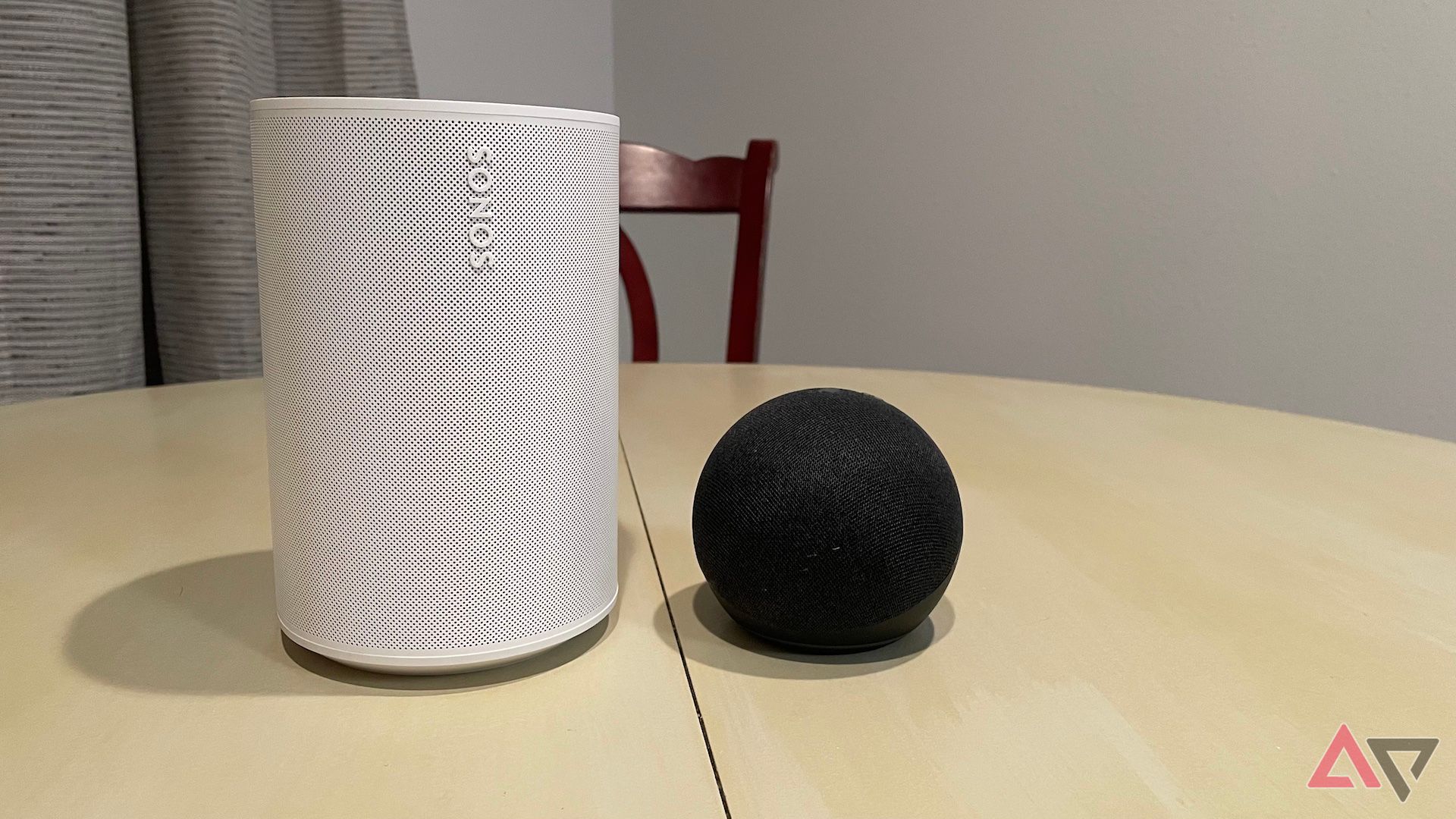 The Sonos Era 100 next to an Amazon Echo Dot (4th Gen)