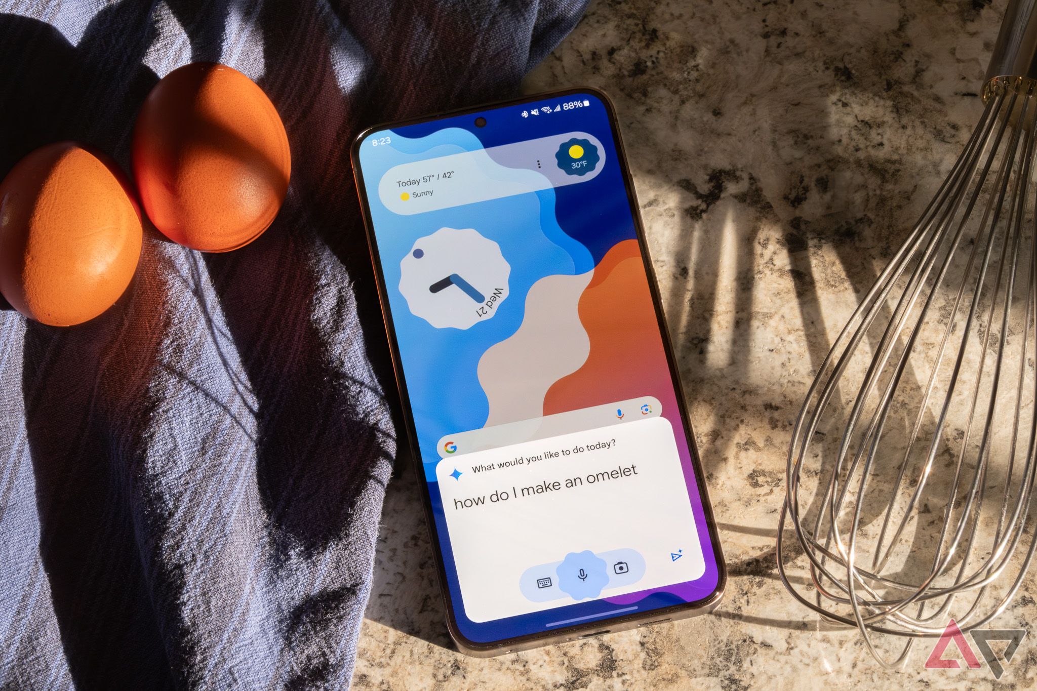 A Samsung smartphone on a kitchen counter displaying the Google Gemini interface.