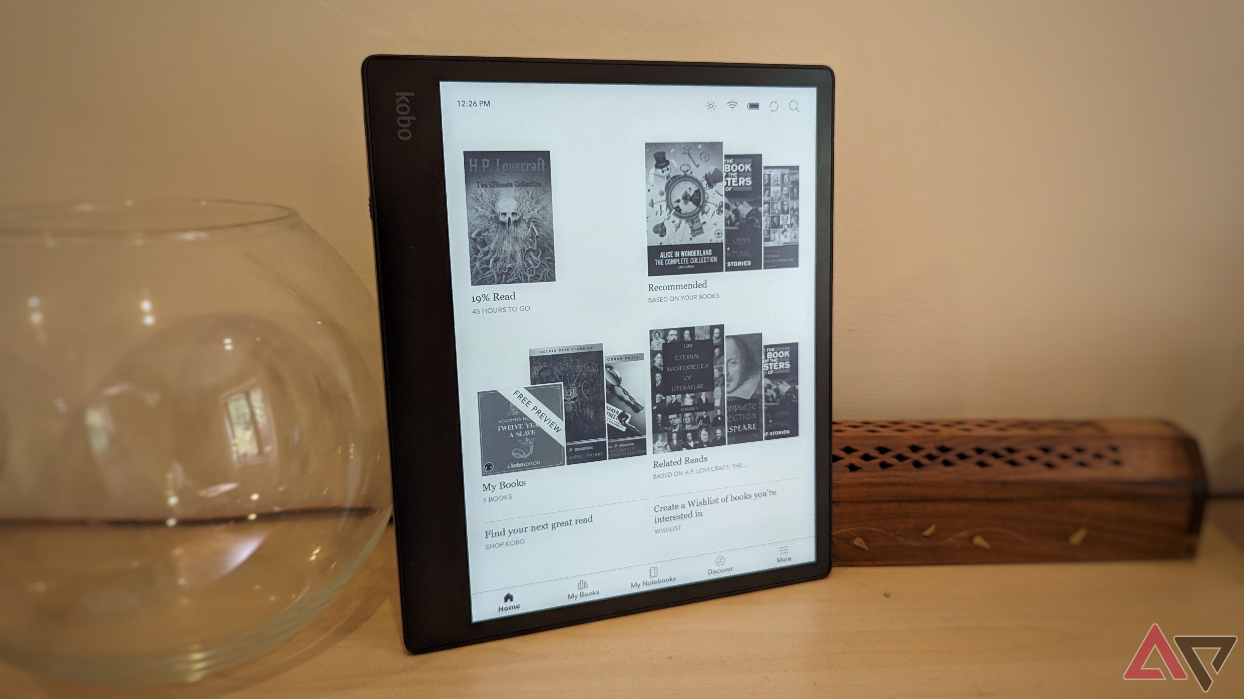 black kobo ereader standing upright on shelf