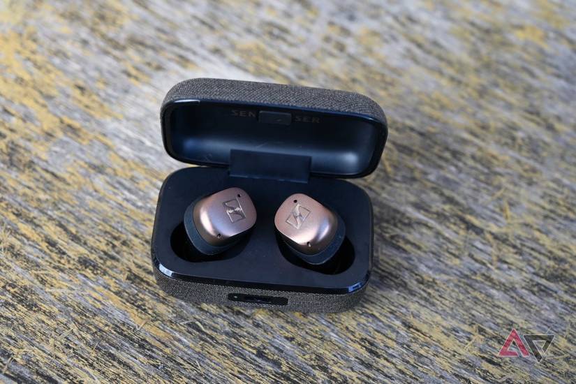 Close up of Sennheiser Momentum Wireless 4 earbuds in case