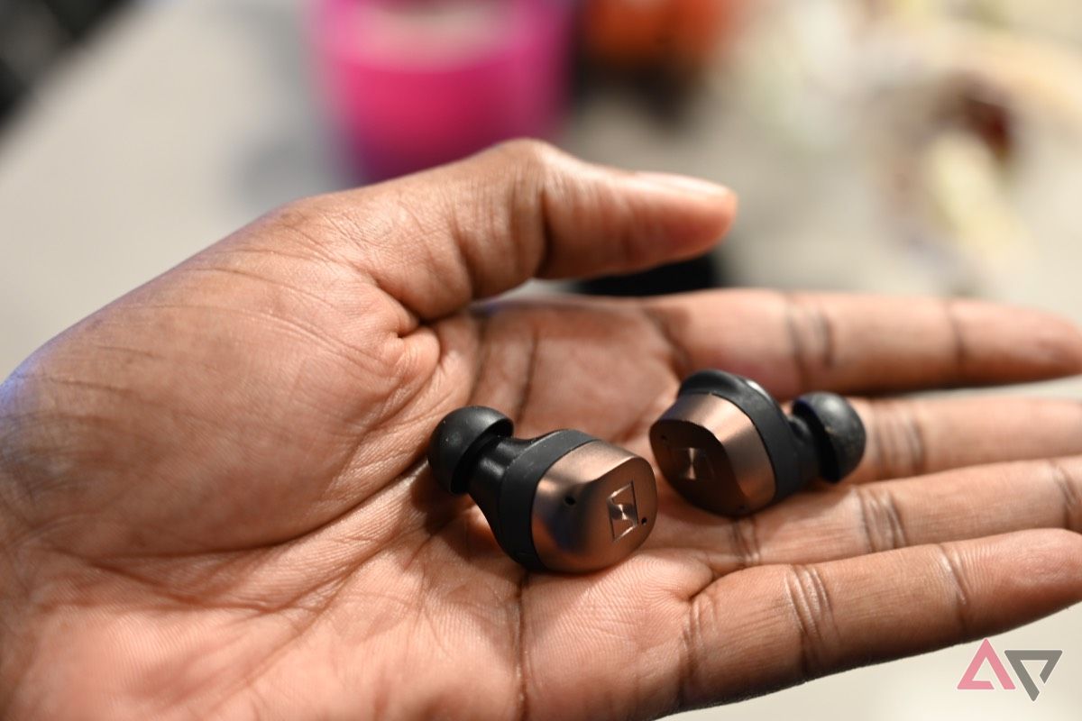 Sennheiser Momentum True Wireless 4 earbuds held in hand