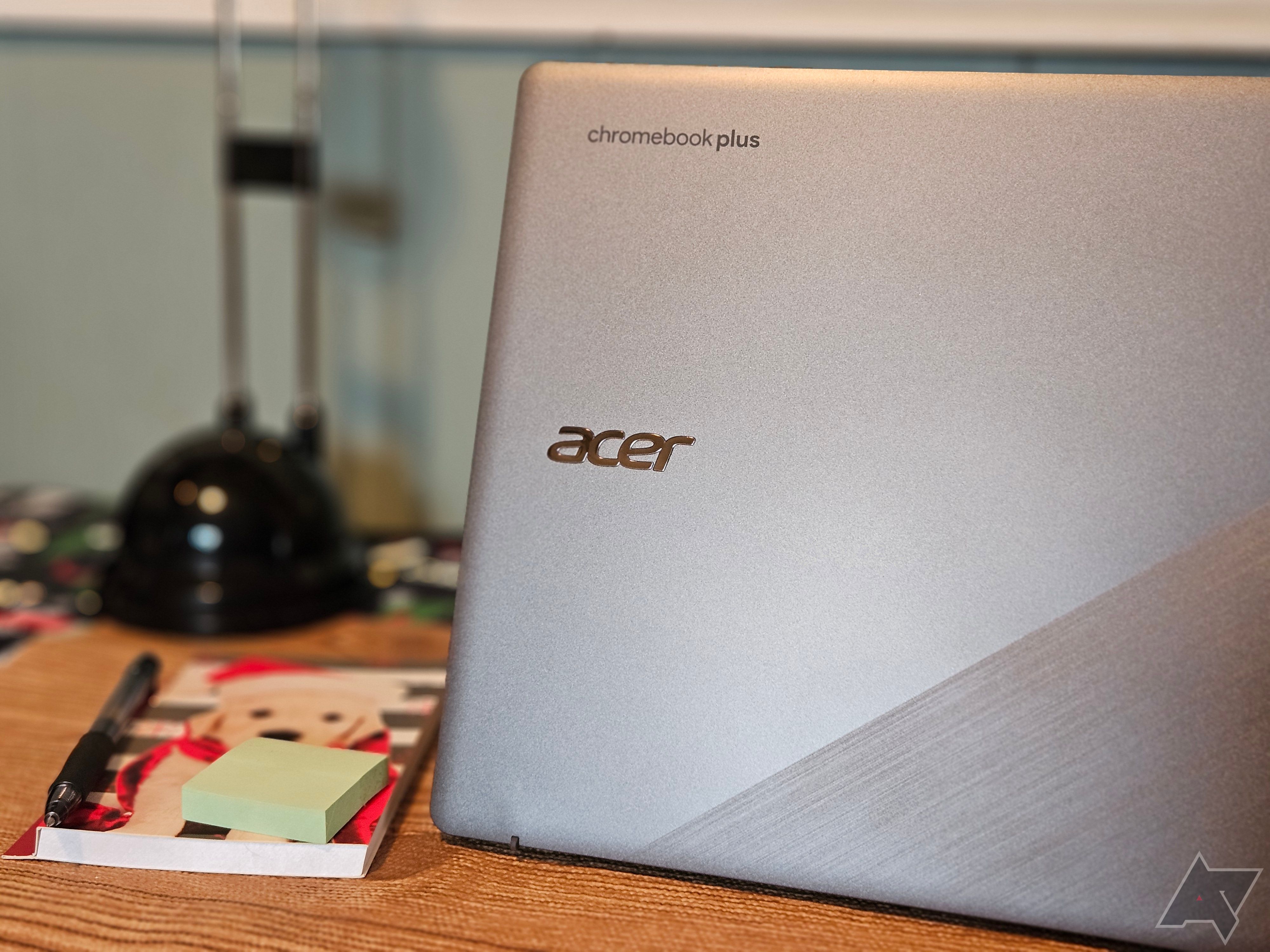Acer-chromebook plus logo side view with notepad and pen