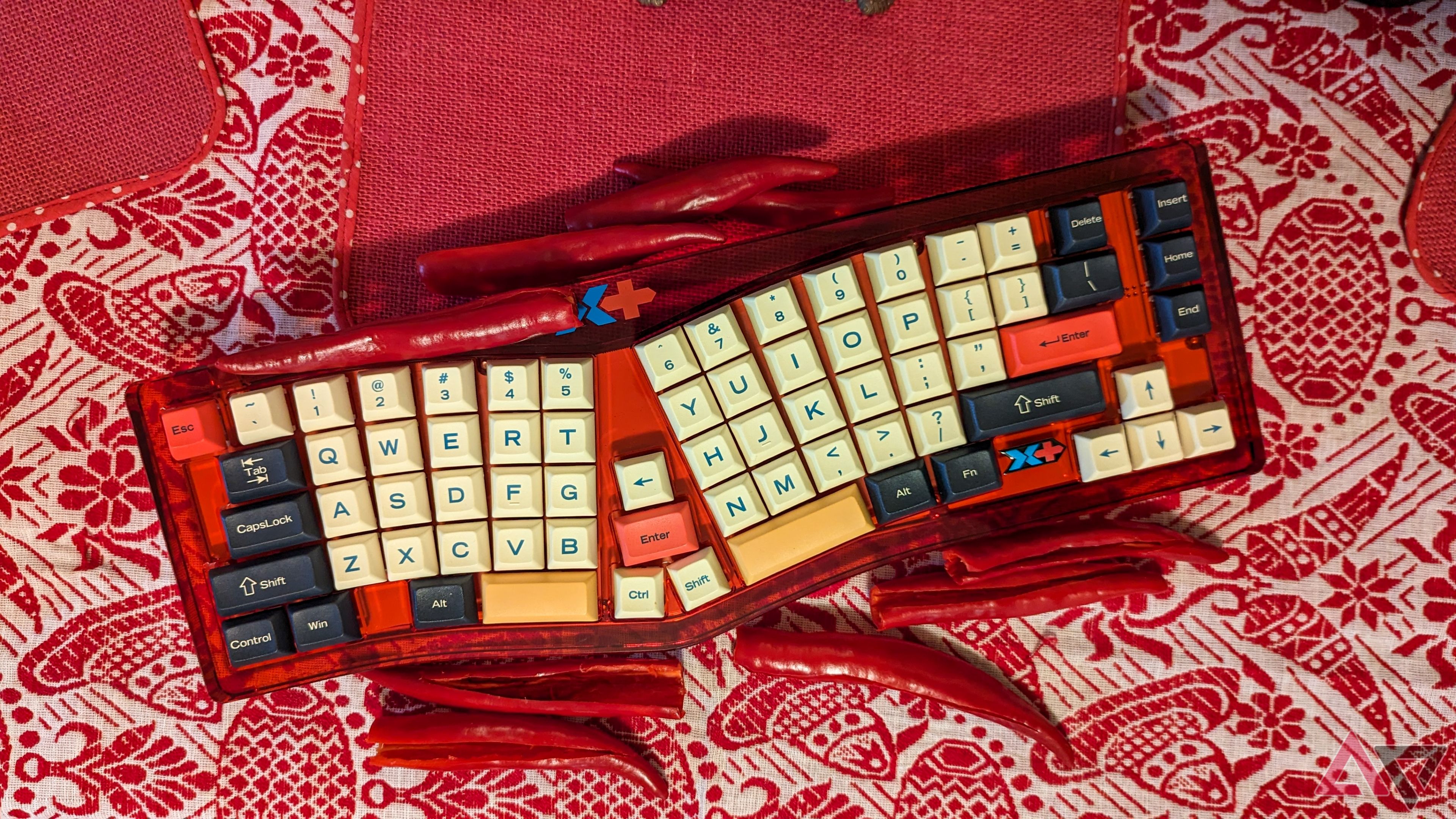 A red VickyBoard on a woven red and white tablecloth surrounded by red chillies about to be pickled