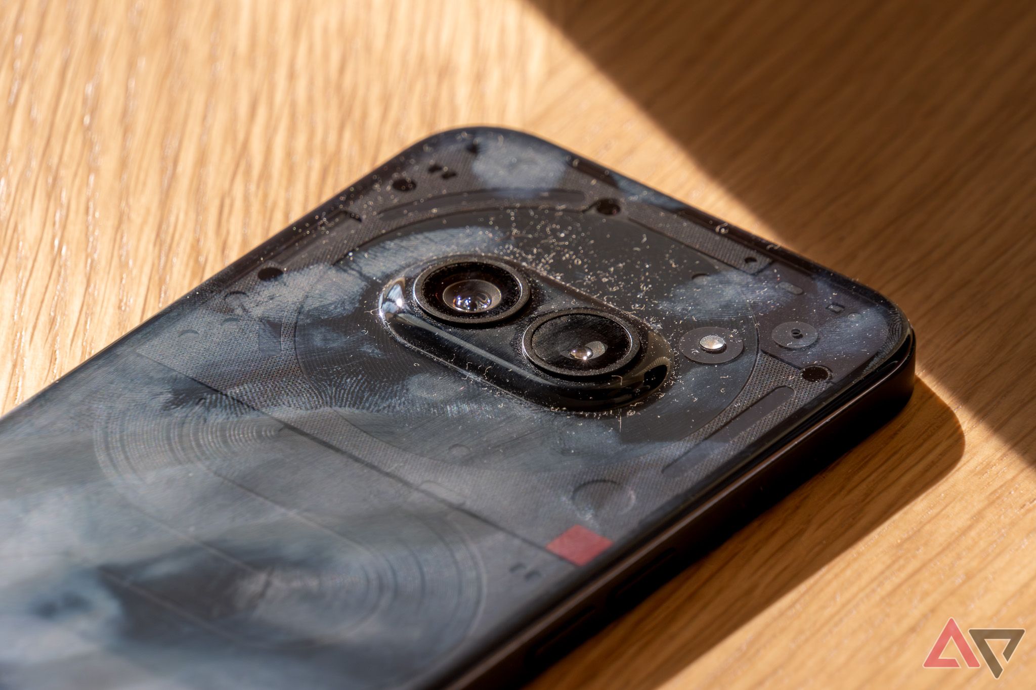 A close-up of the Nothing Phone 2a showing smudges and dust