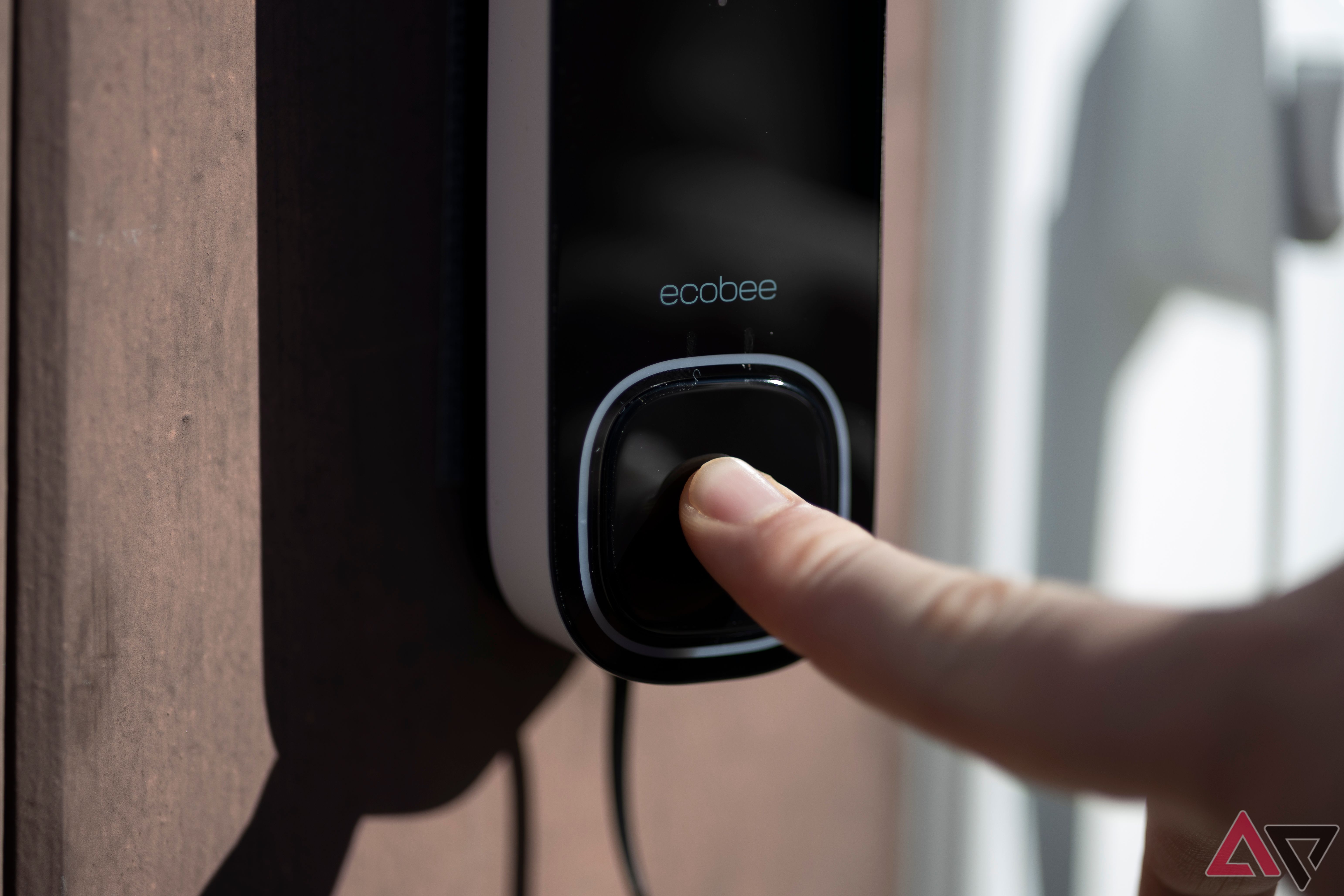 Close up view of someone ringing Ecobee Smart Doorbell Camera (Wired)