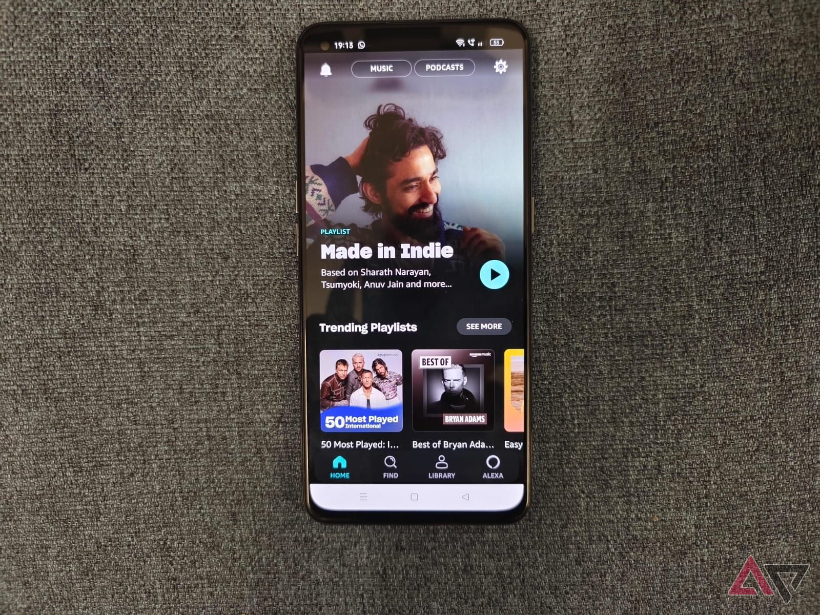 Photo of a phone showing the home screen of Amazon Music