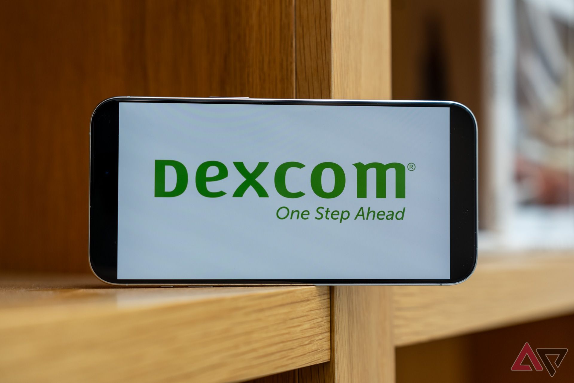 An iPhone with Dexcom Logo