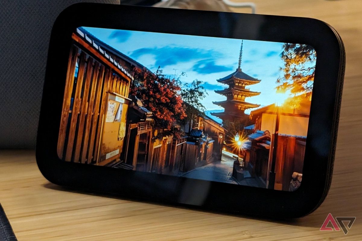 The Echo Show 5 (3rd Gen) on a desk showing an image of Kyoto, Japan in Photo Frame Mode.