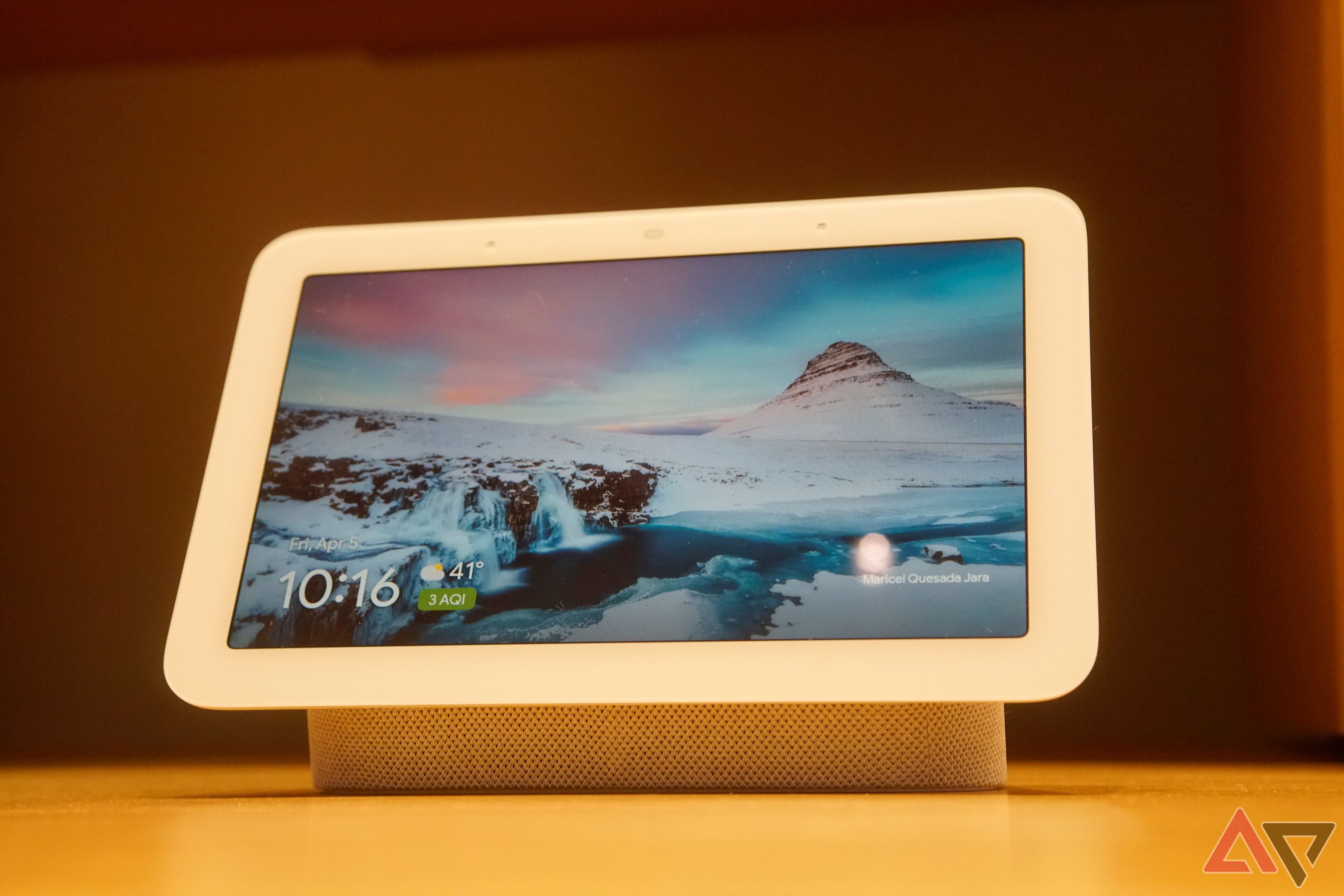 A Google Nest Hub tablet on a table.