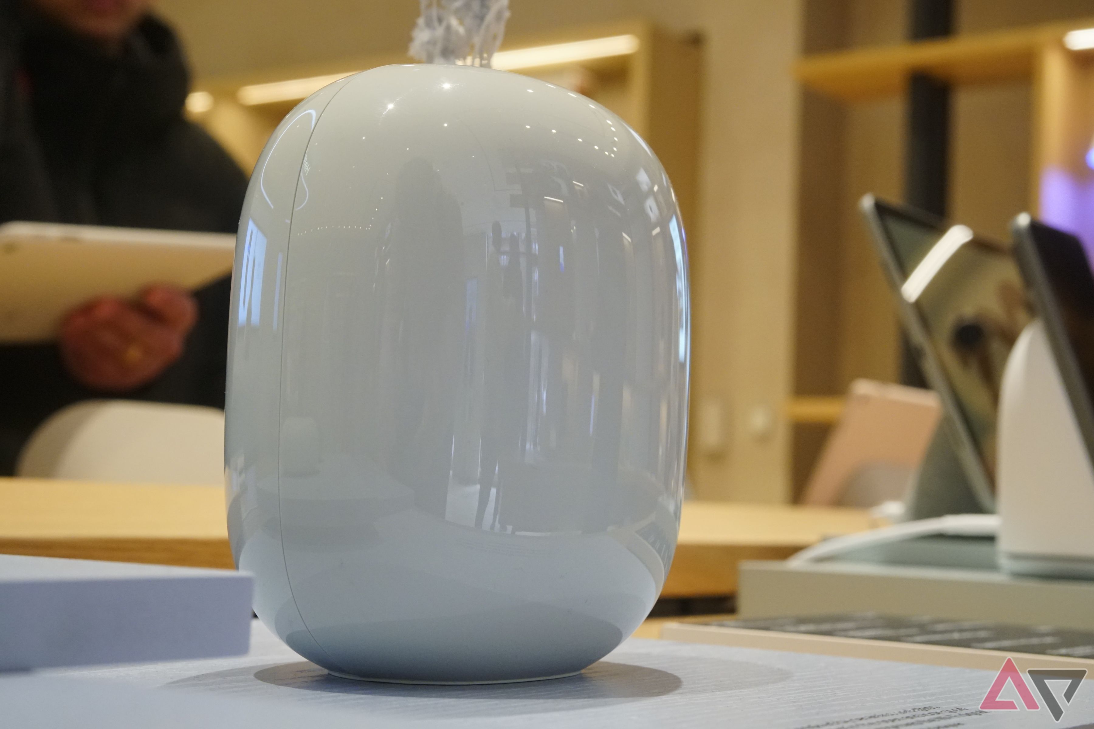 A blue Google Nest Wifi router on display at the Google Store in Boston.