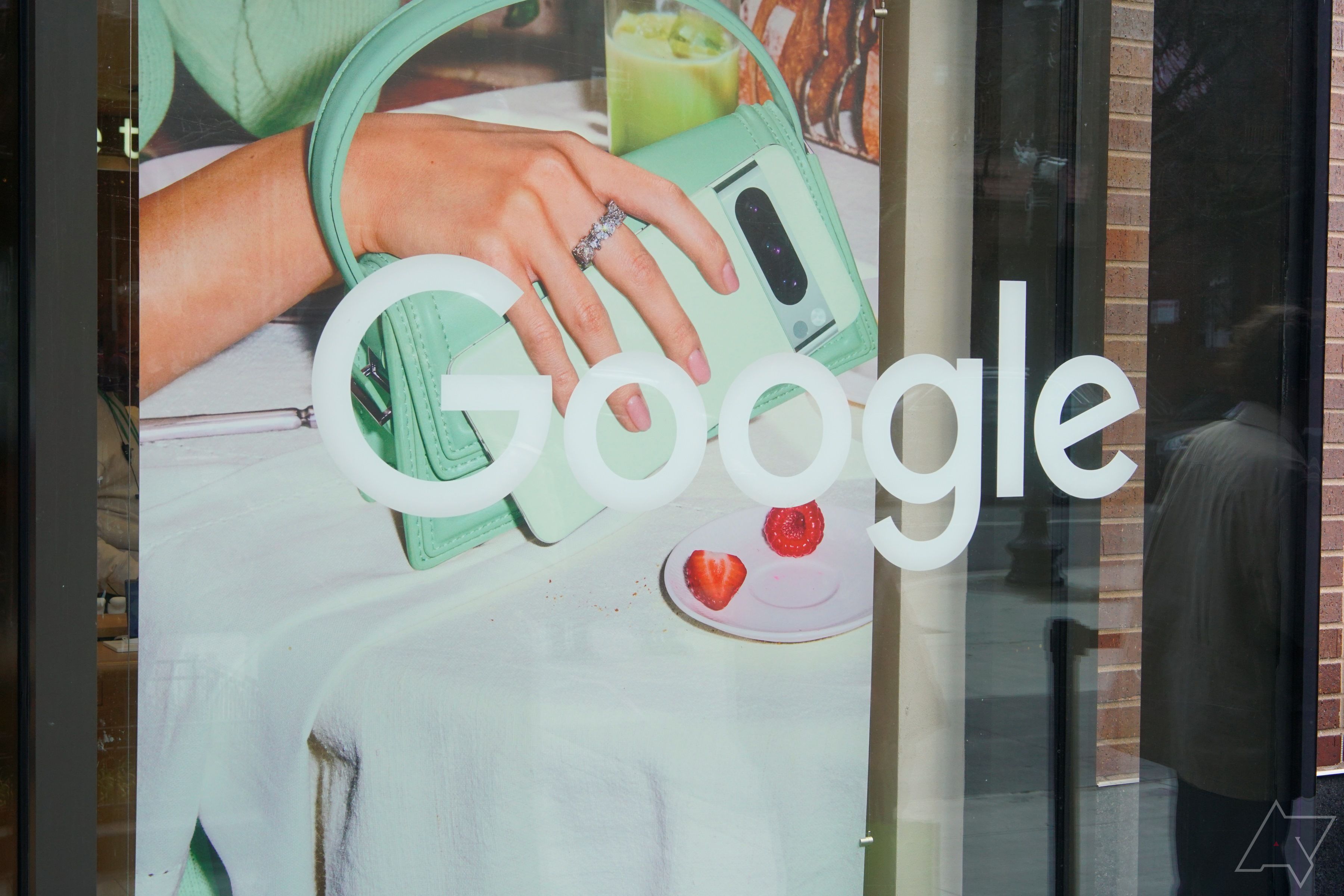 The Google wordmark printed on a window outside a retail location.