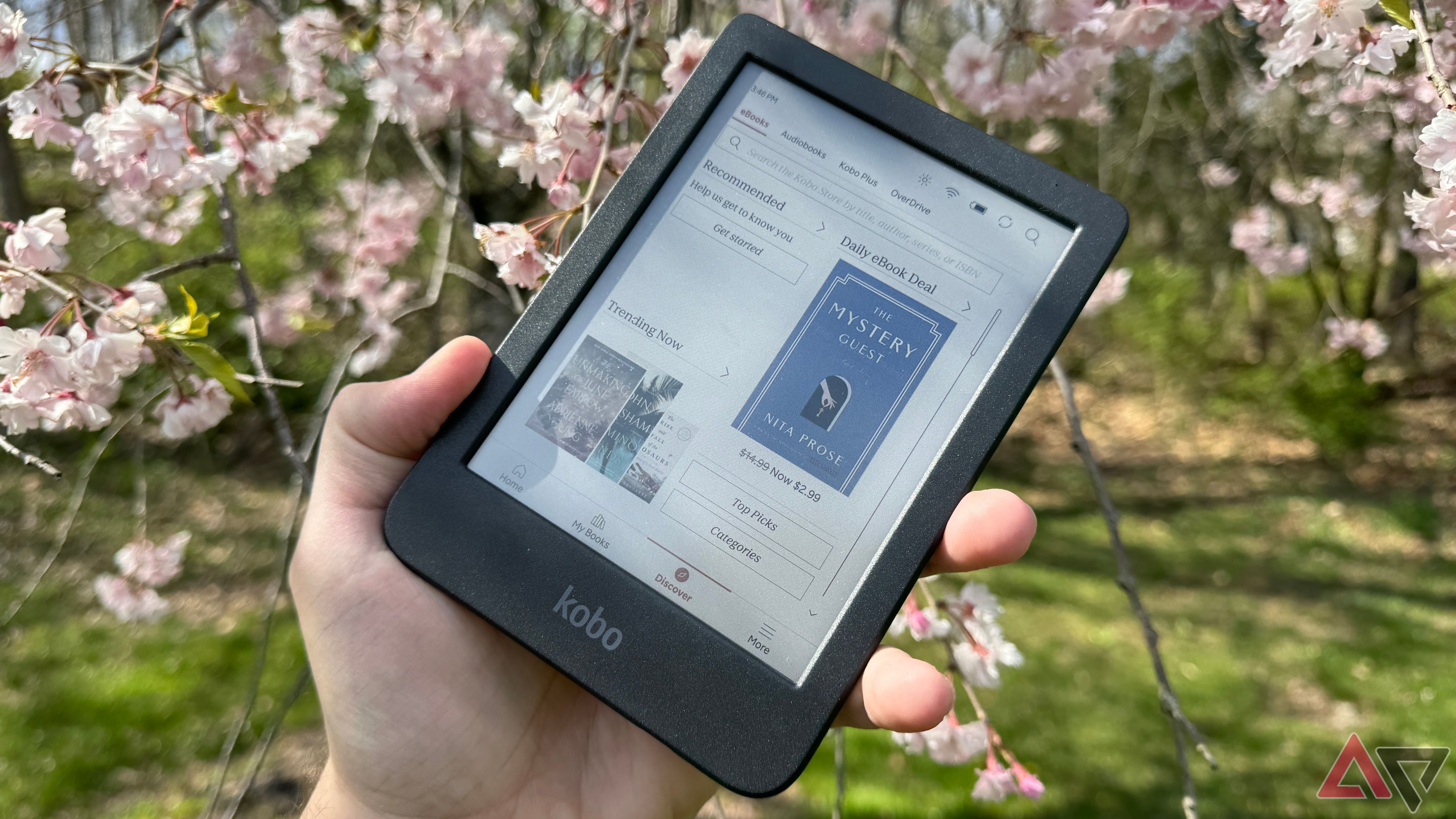 Kobo Clara Colour home page held against a floral background