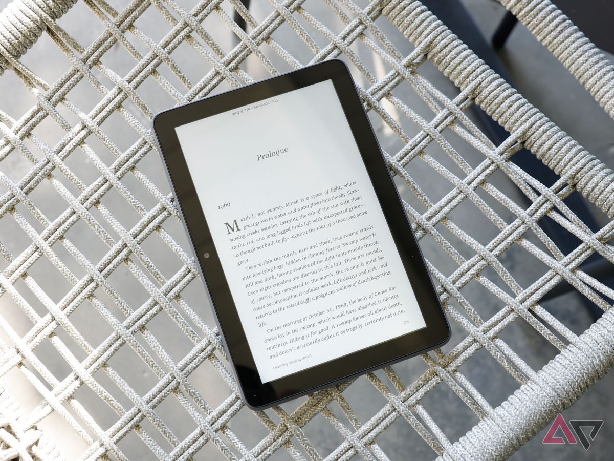 A Kindle Fire HD 8 Plus lying on a woven outdoor chair