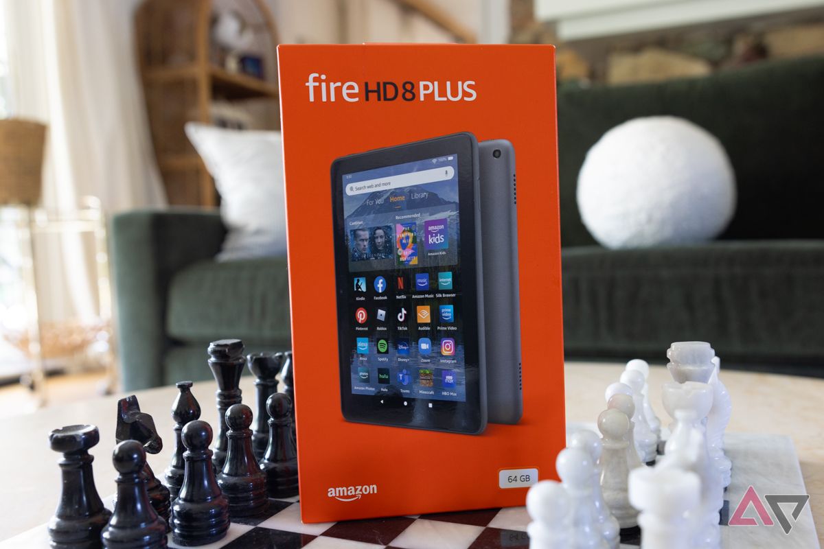 Kindle Fire HD 8 Plus orange box among a chess set.