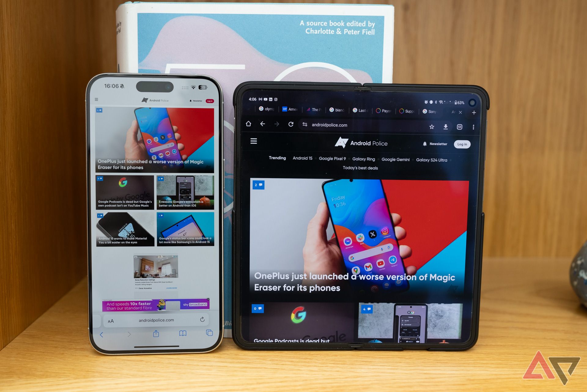 Next to the OnePlus Open, the iPhone 15 Pro Max is fully folded open to reveal its respective browser.