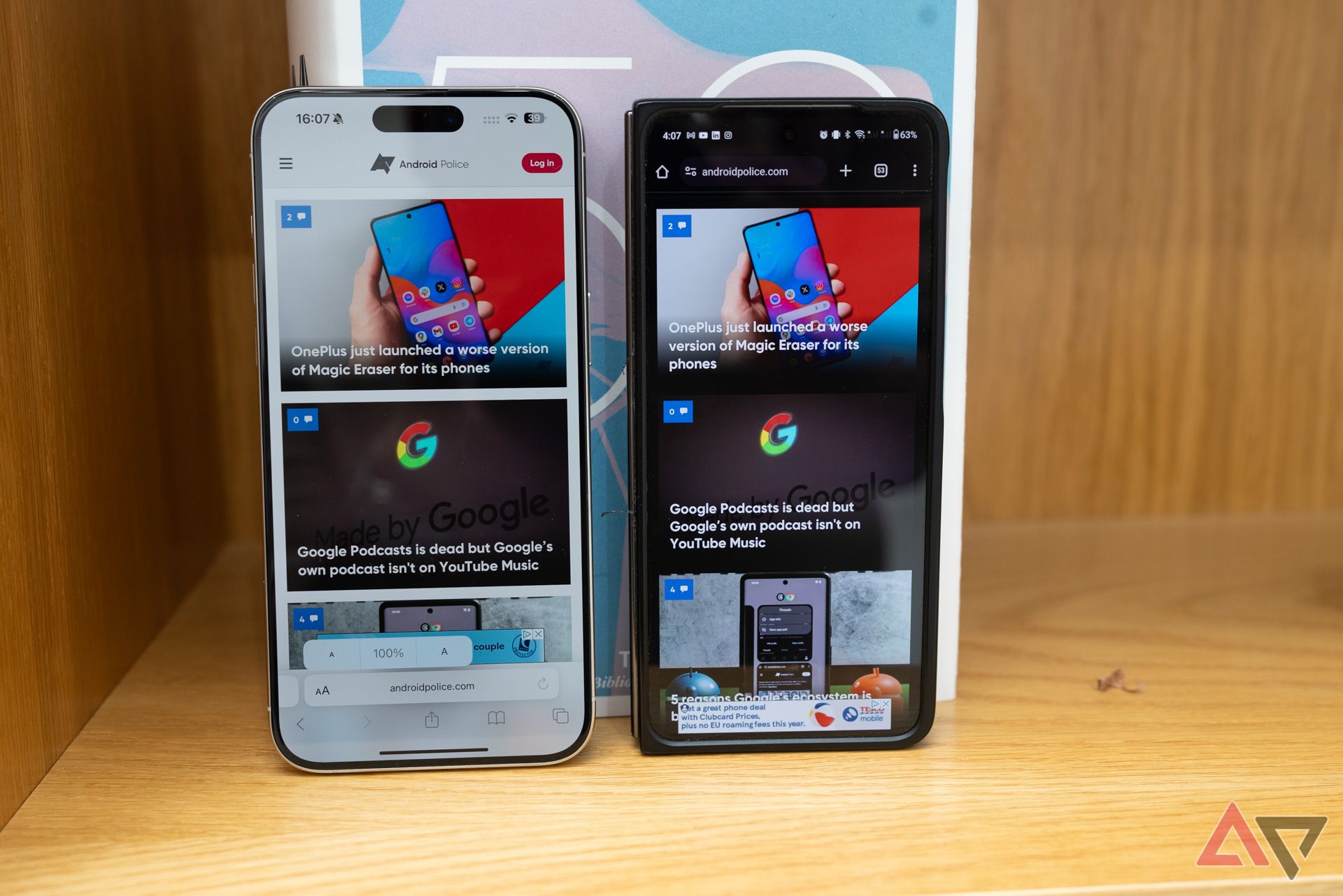 The iPhone 15 Pro Max next to the OnePlus Open showing their respective browsers.