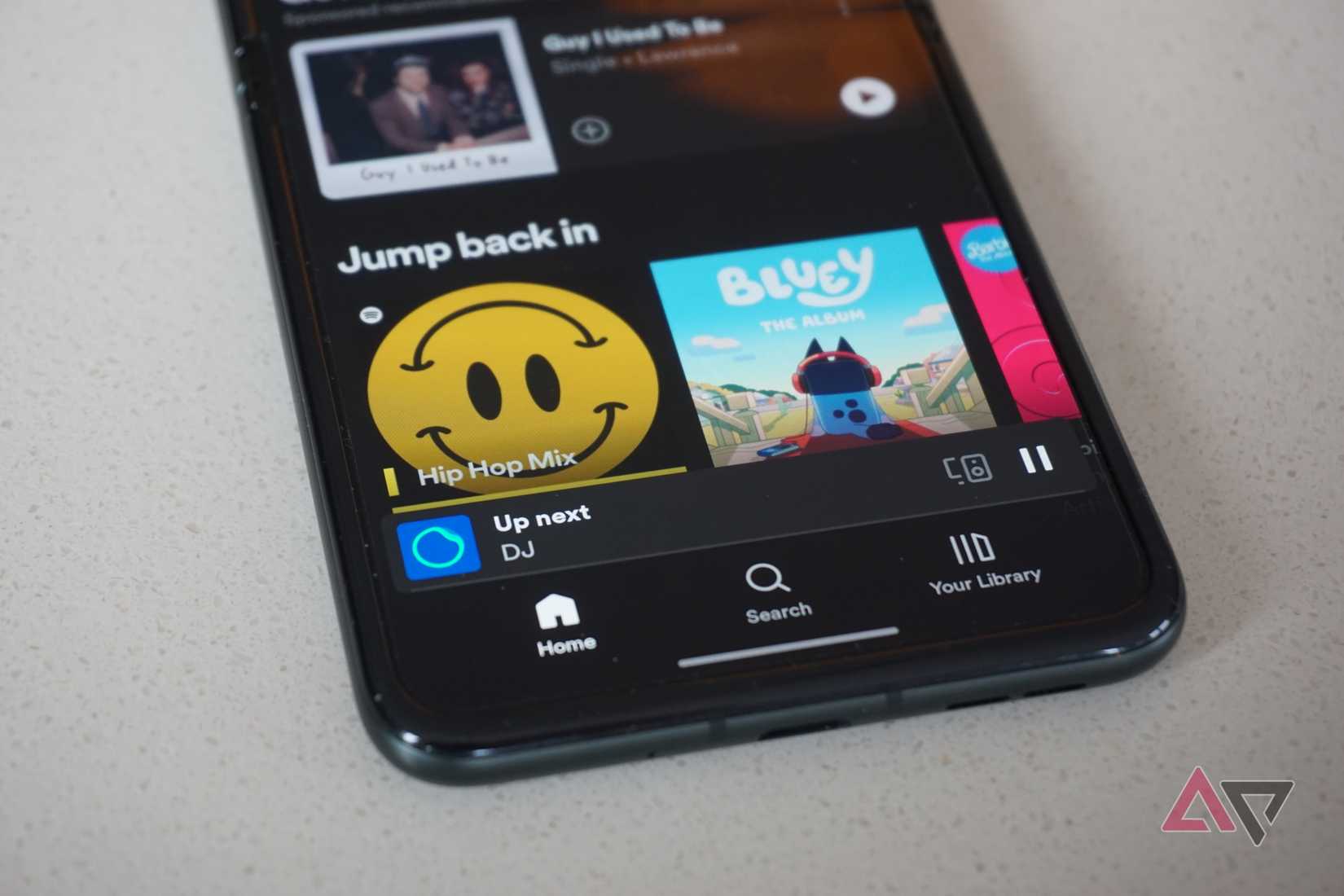 A close-up view of the Spotify DJ bottom bar view on mobile