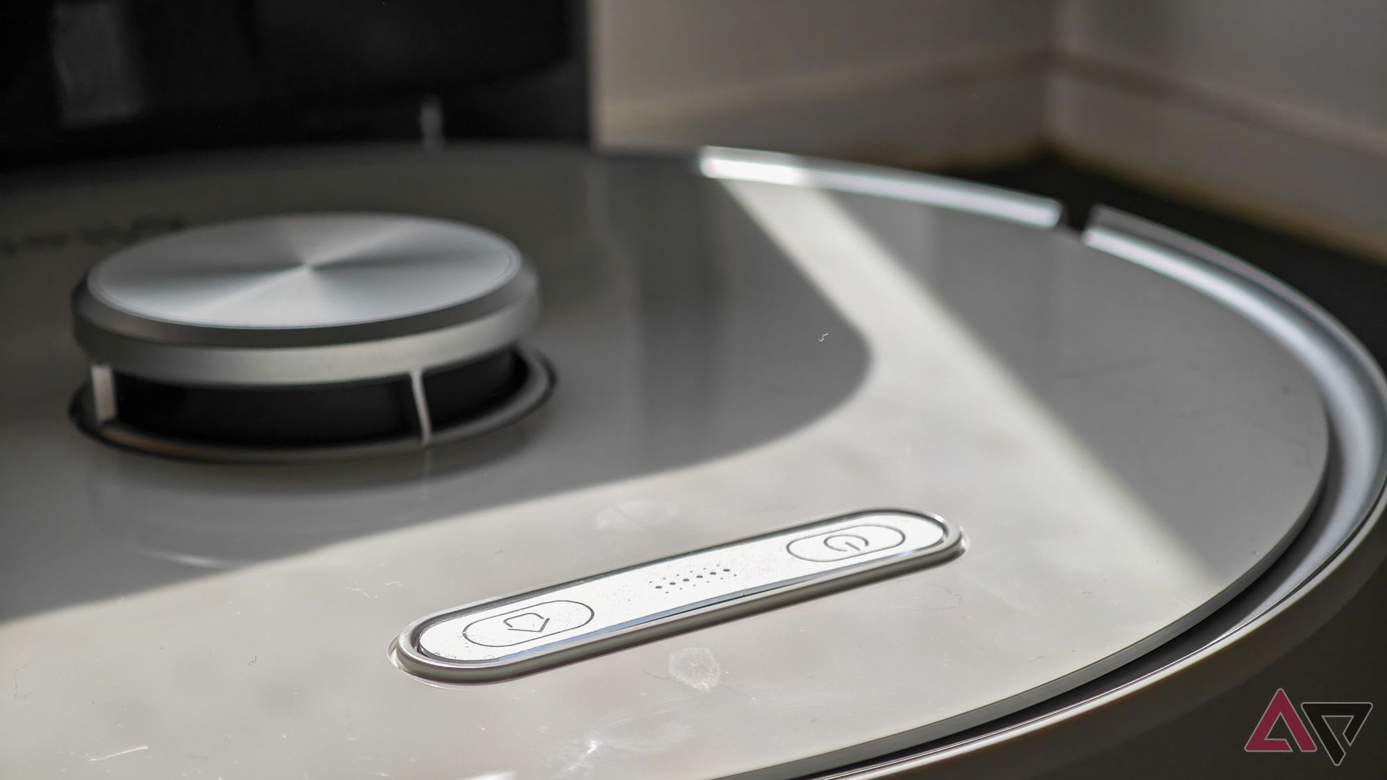 A close-up photo of the buttons on the Ultenic T10 Pro robot vacuum