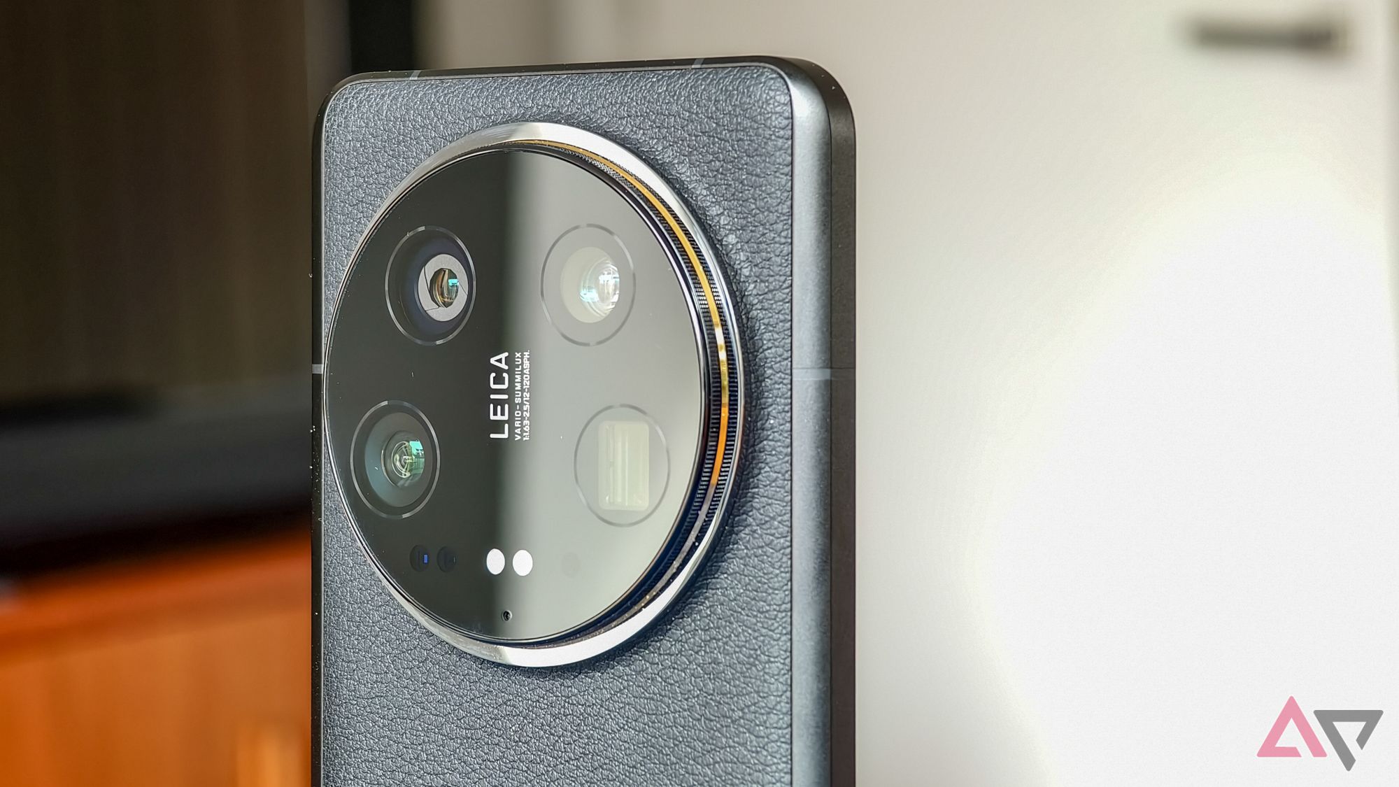 Xiaomi 14 Ultra camera in close-up, with light reflecting off half the camera module