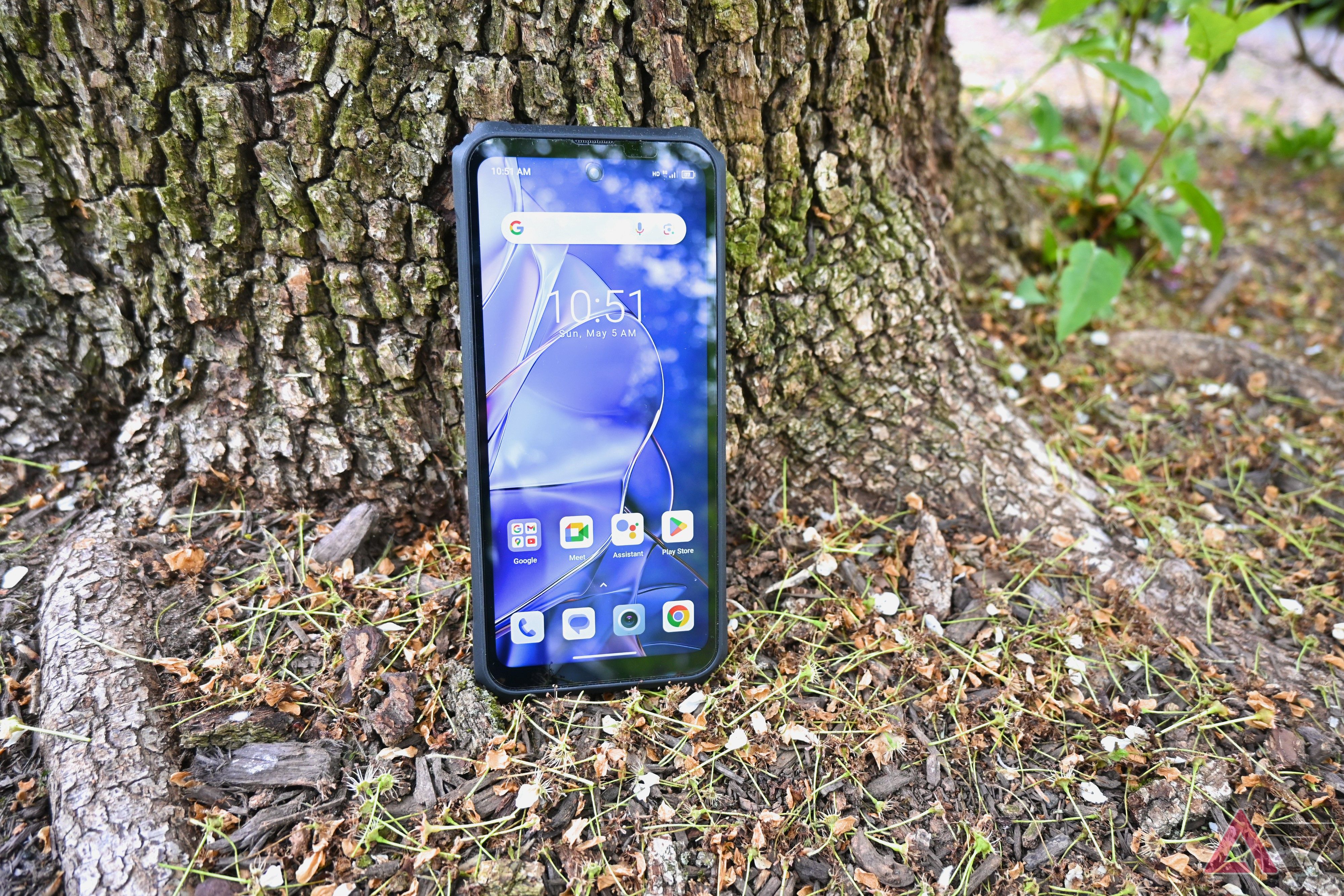 Blackview BL9000 Pro against a tree with the display on