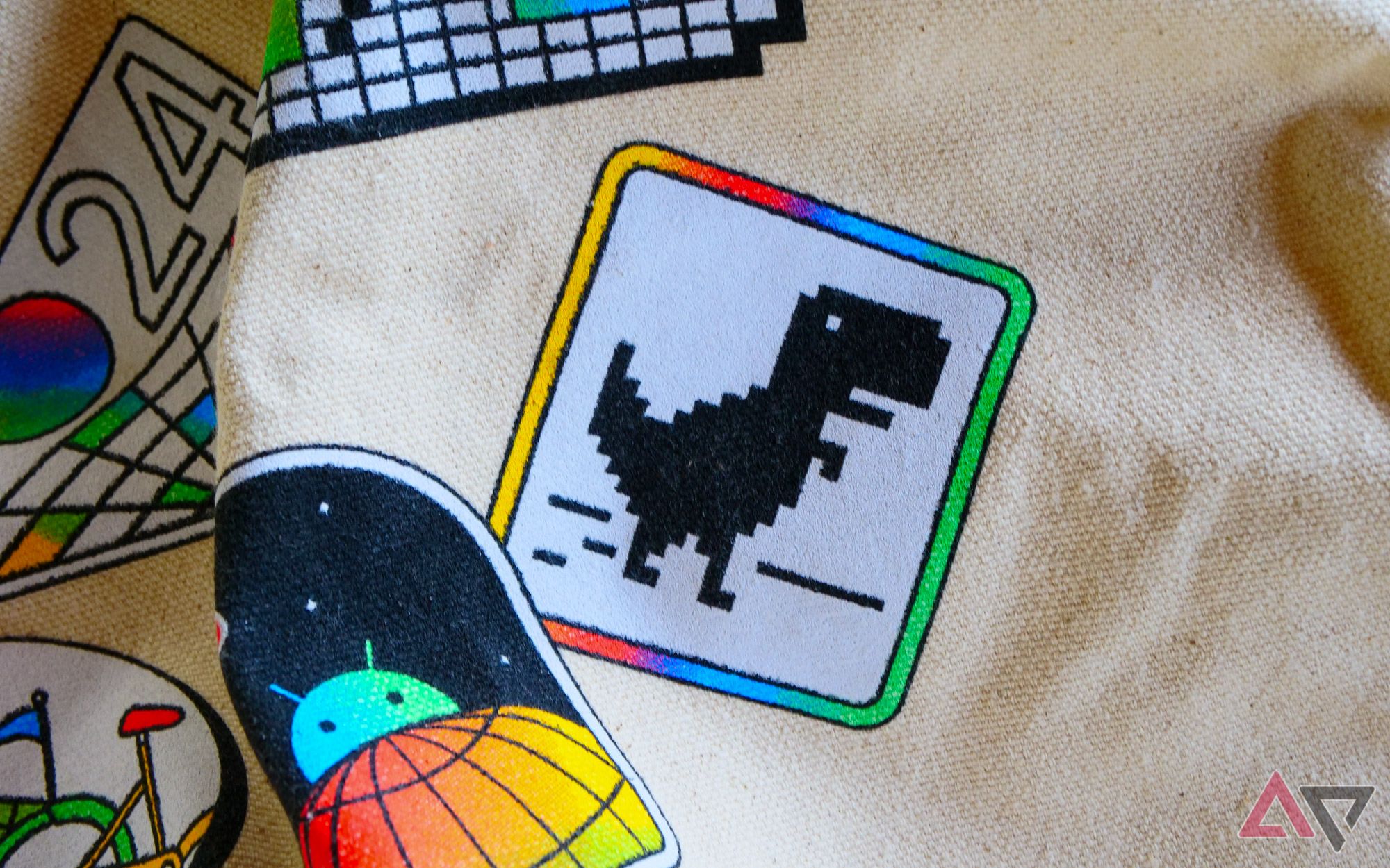 A close-up on the Chrome Dino on the Google I/O 2024 tote bag.