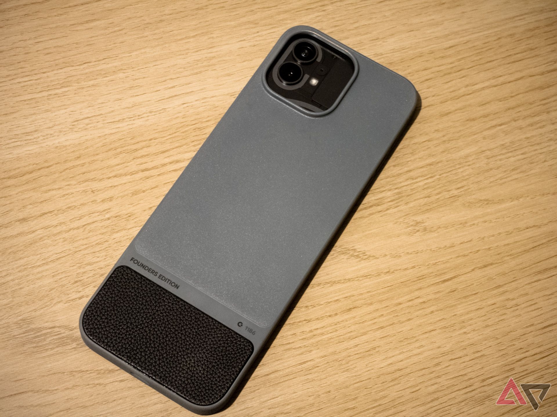 The Nothing Phone 1 sitting in a Clicks iPhone case.