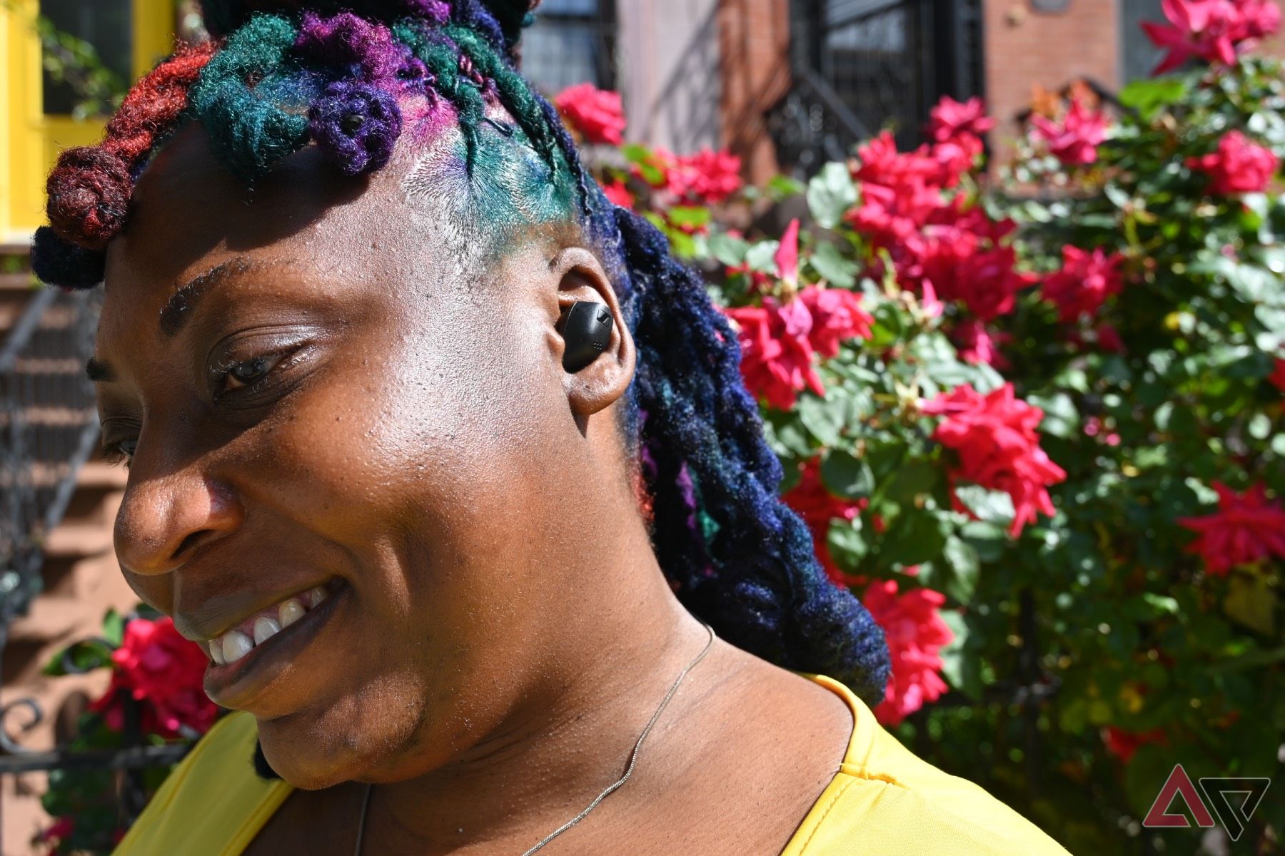 Frontal shot of African-American woman wearing Sennheiser Accentum True Wireless