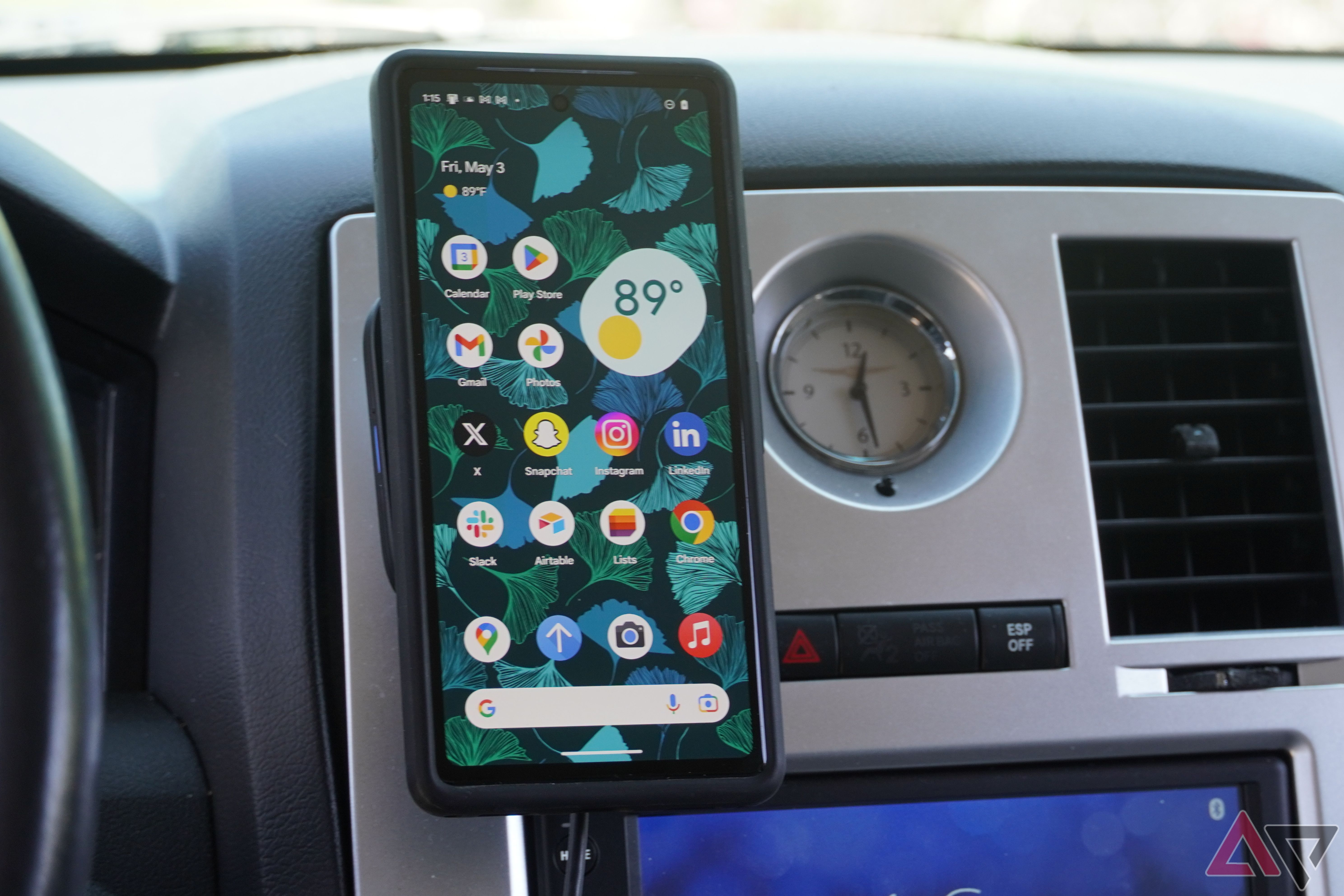 A Pixel 7a mounted to the ESR Qi2 wireless car charger.