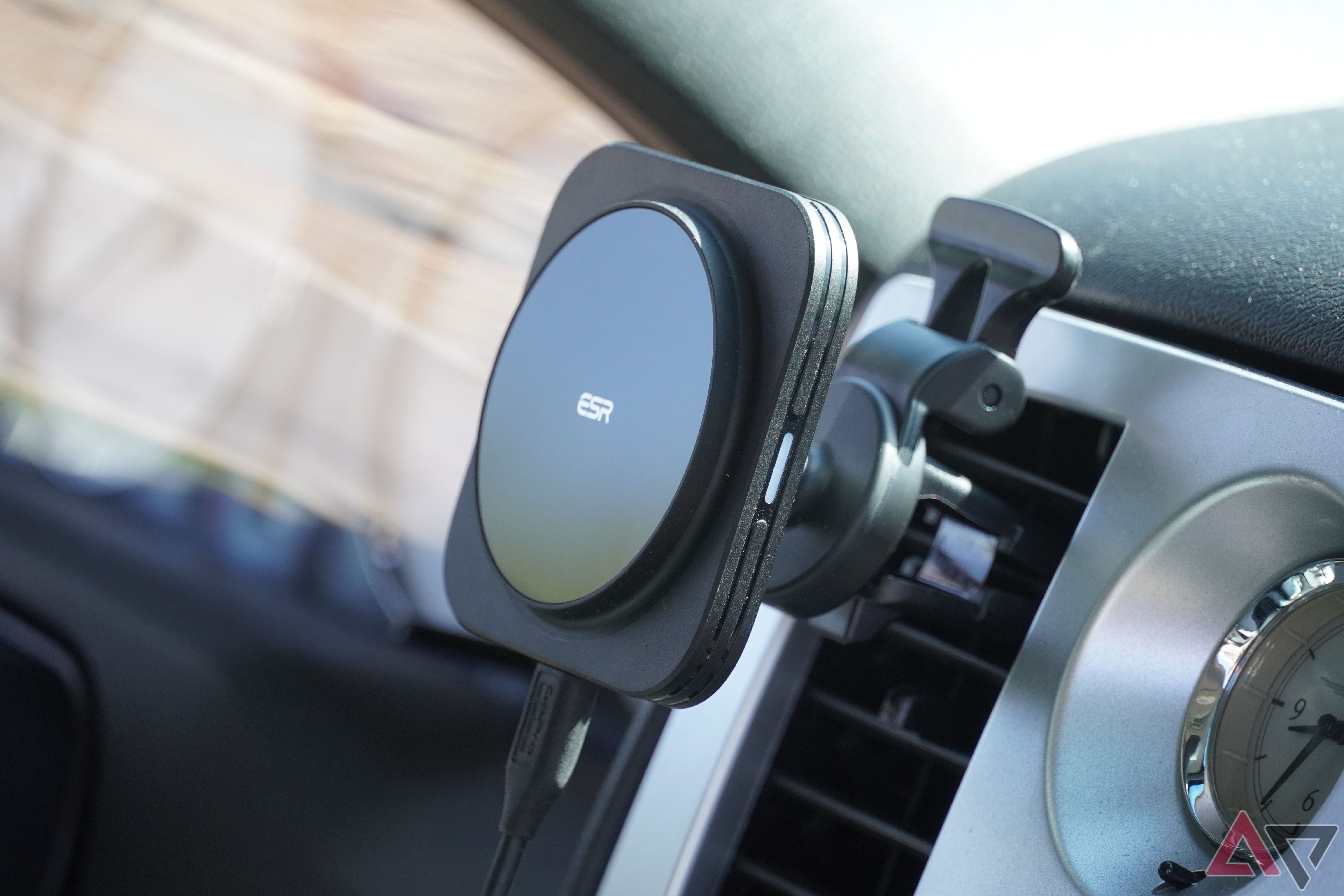 A USB-C cable connected to the ESR wireless car charger.