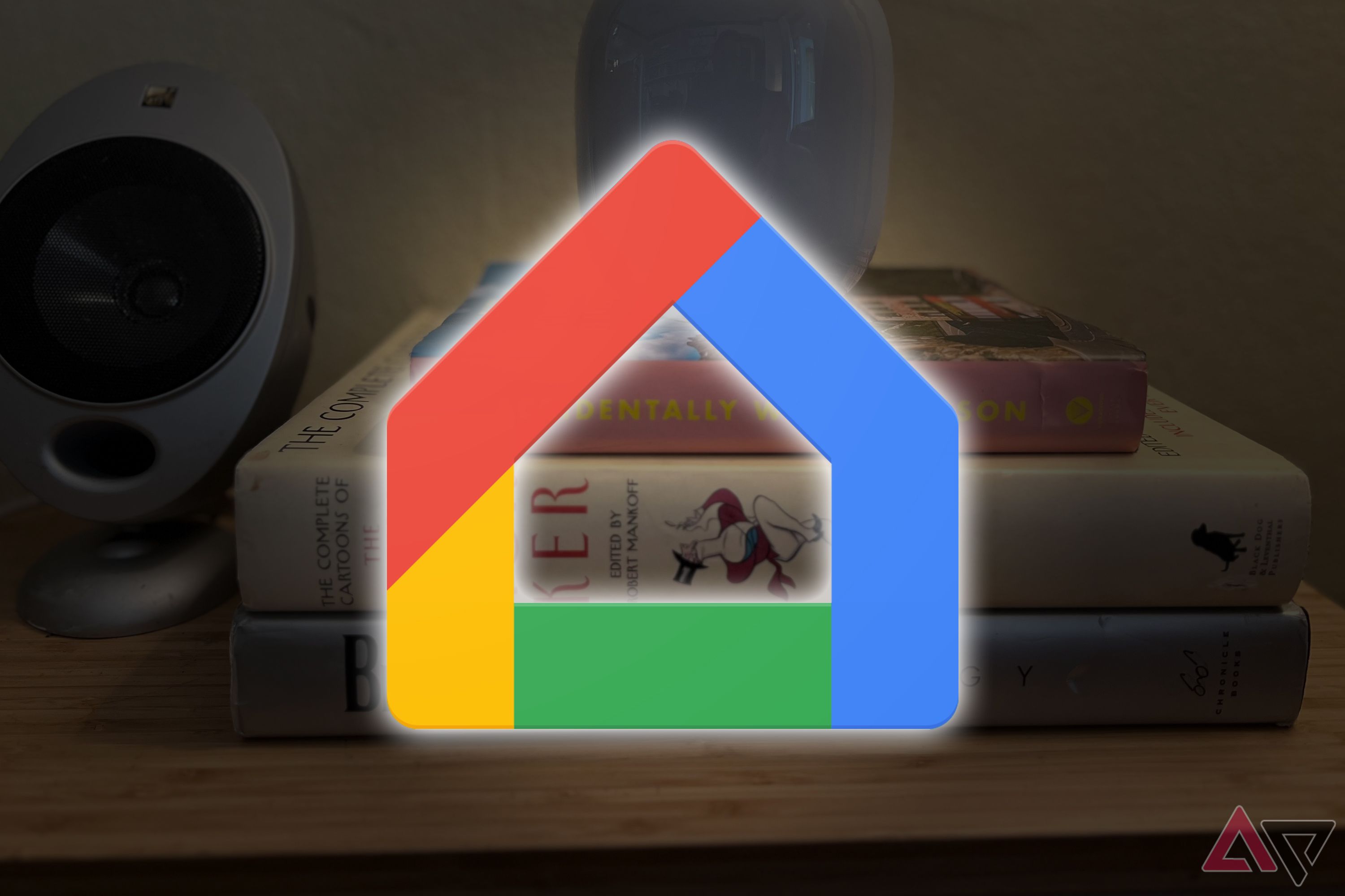 Google Home logo over an image of a speaker on books