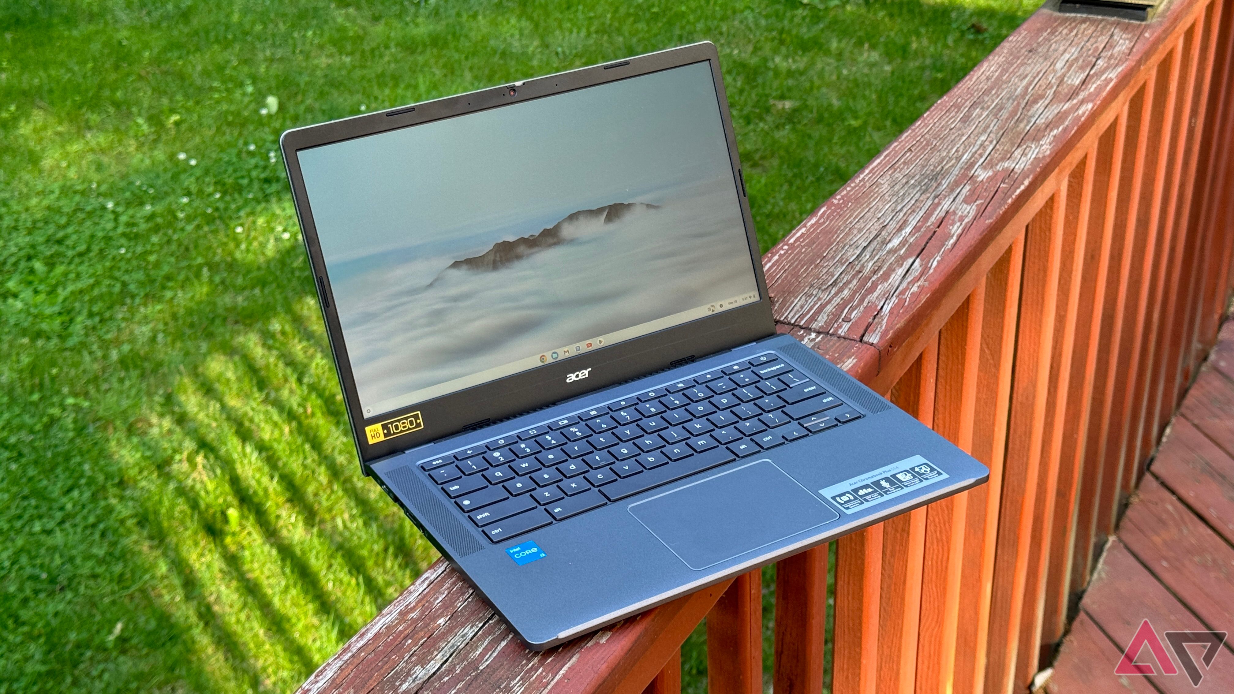 Acer Chromebook Plus 514 sitting on the edge of an outdoor deck