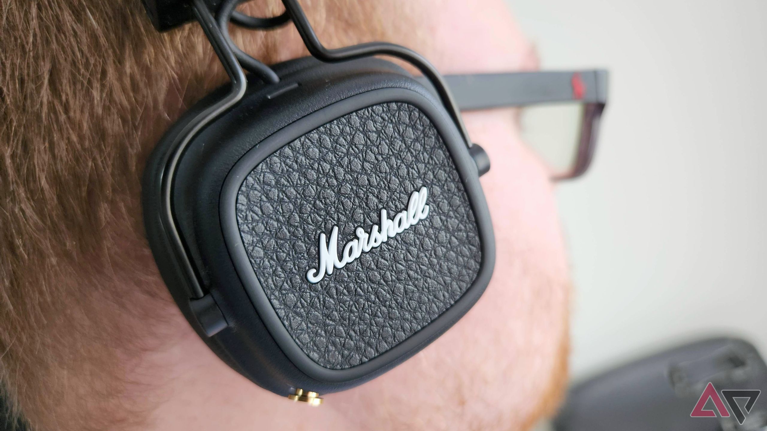 A close up side view of the Marshall Major V headphones while listening to music